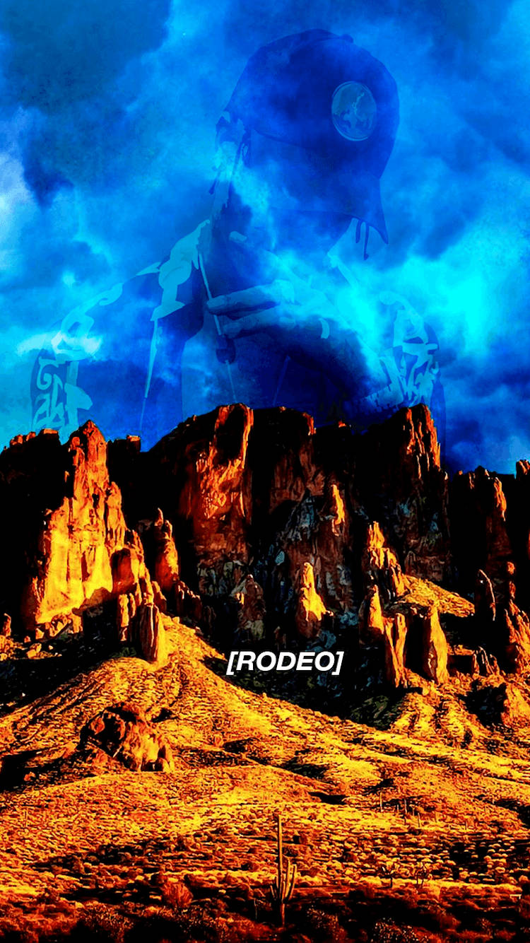 Travis Scott Astroworld 桌布 壁紙 — 一個幽靈般的藍色牛仔身影籠罩在陽光明媚的沙漠峽谷上，周圍有橙色岩層和仙人掌。