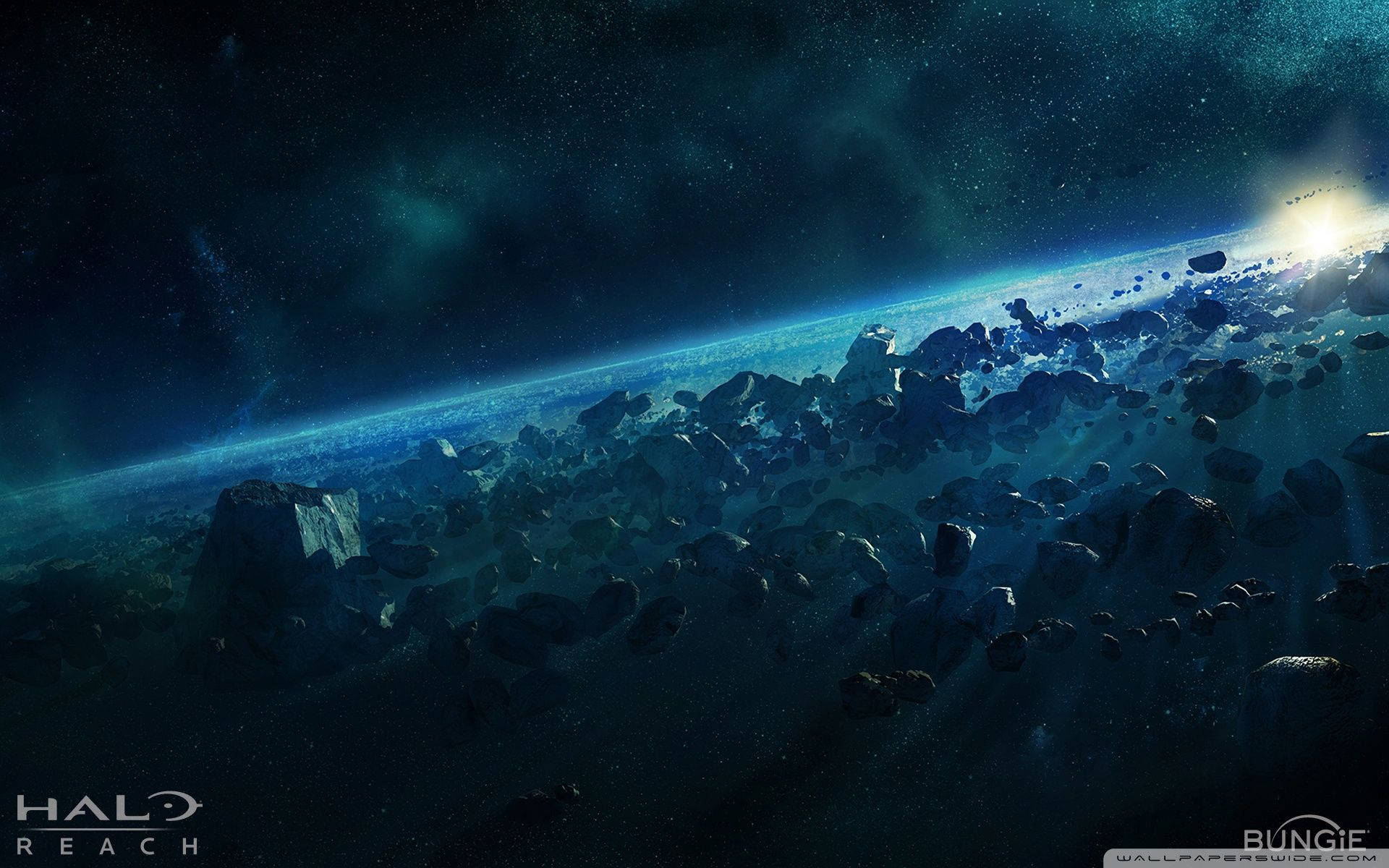 Reach 桌布 壁紙 — 一個廣闊的小行星帶在深空中漂流，遠處有一顆發光的行星在星空下彎曲。