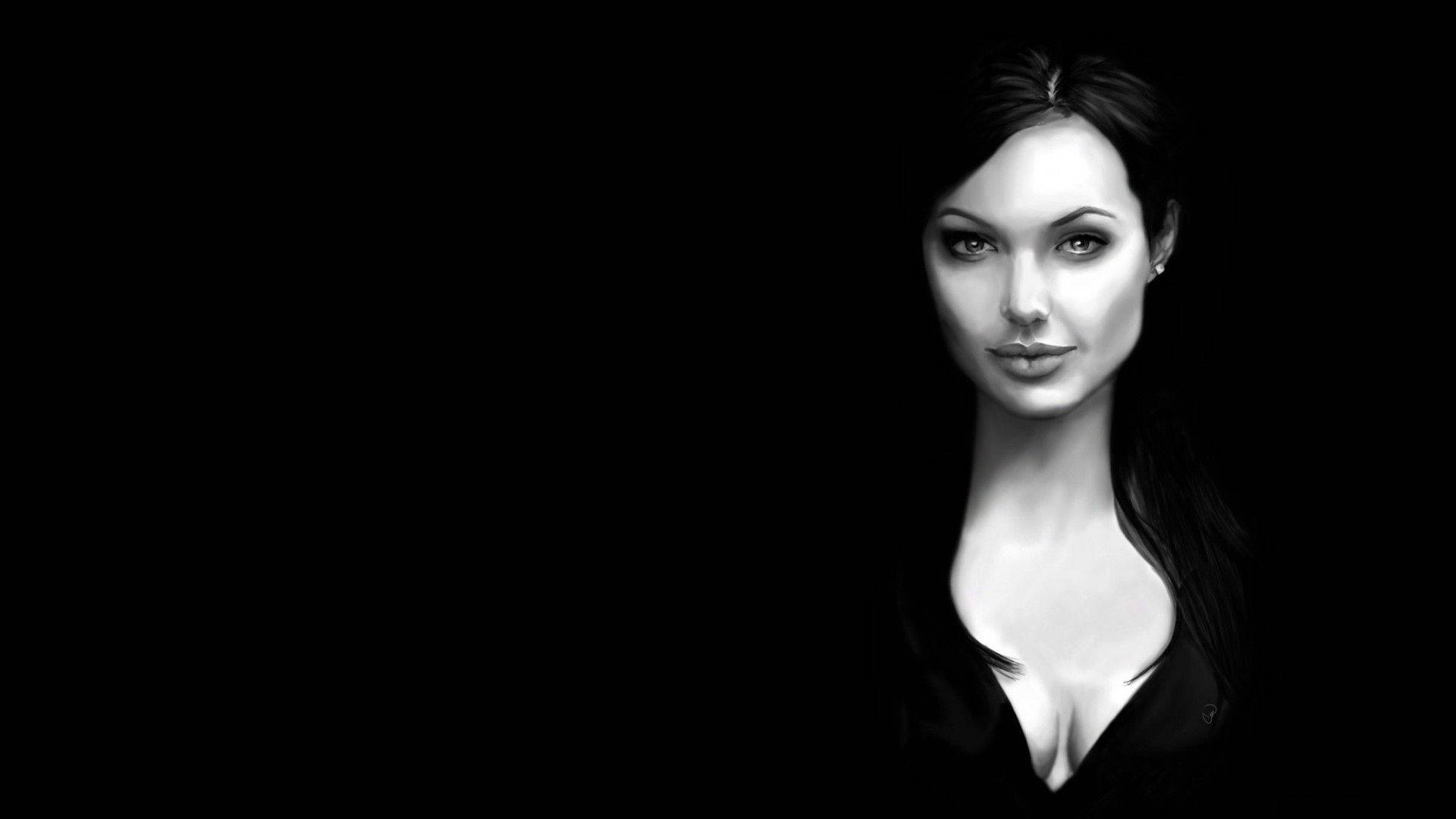 Angelina 桌布 壁紙 — 一個引人注目的黑白肖像，一位女士在純黑色背景下帶著強烈的凝視。