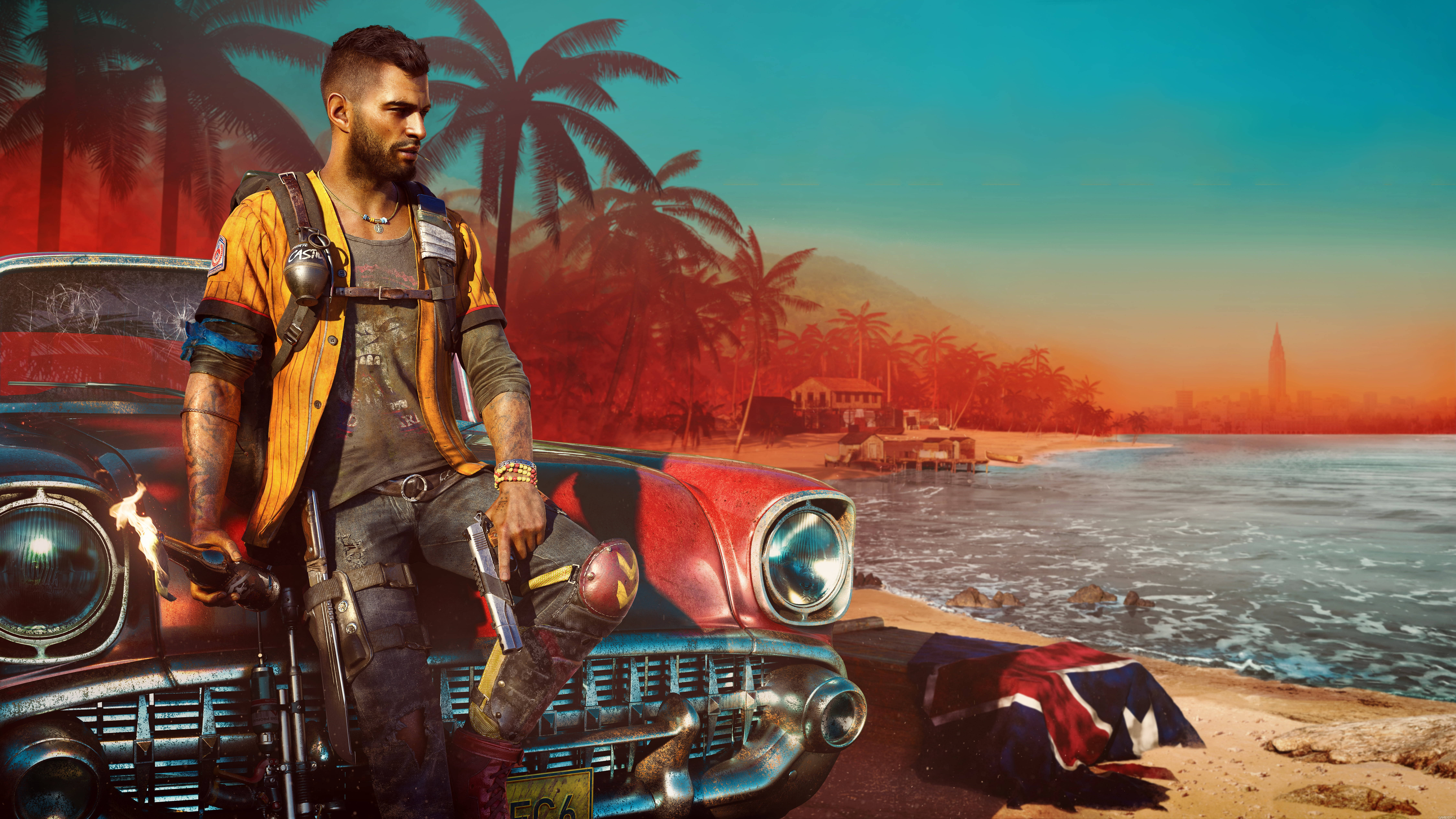 極地戰嚎 6 桌布 壁紙 — 一個強壯有刺青的男人在熱帶海灘日落時分靠在一輛復古紅色汽車上，背景有棕櫚樹和遠處的城鎮。
