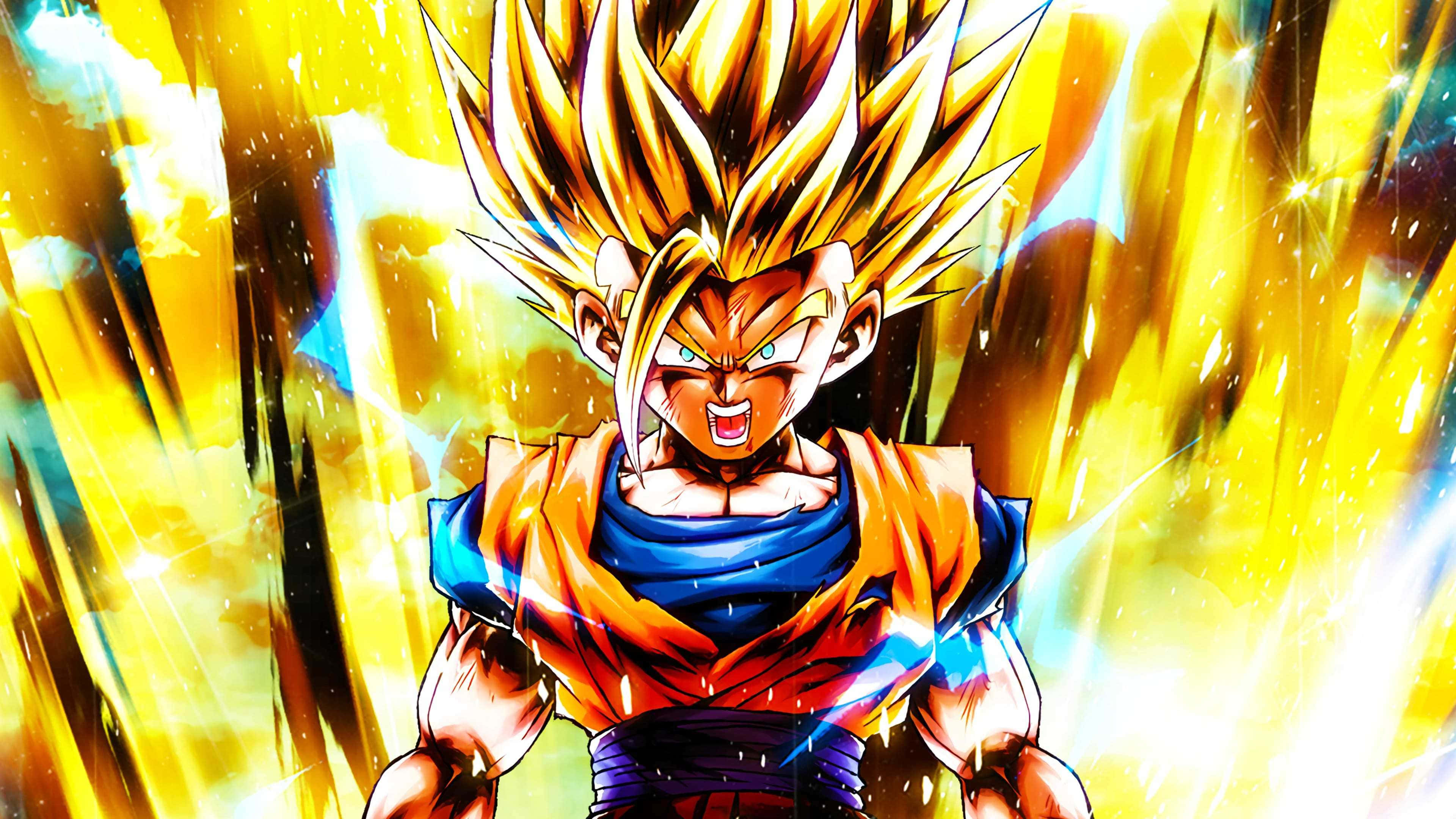 Teen Gohan 桌布 壁紙 — 一個強大的動漫戰士，擁有尖刺的金色頭髮和發光的氣場，在充滿活力的黃色和藍色背景下散發出強烈的能量。