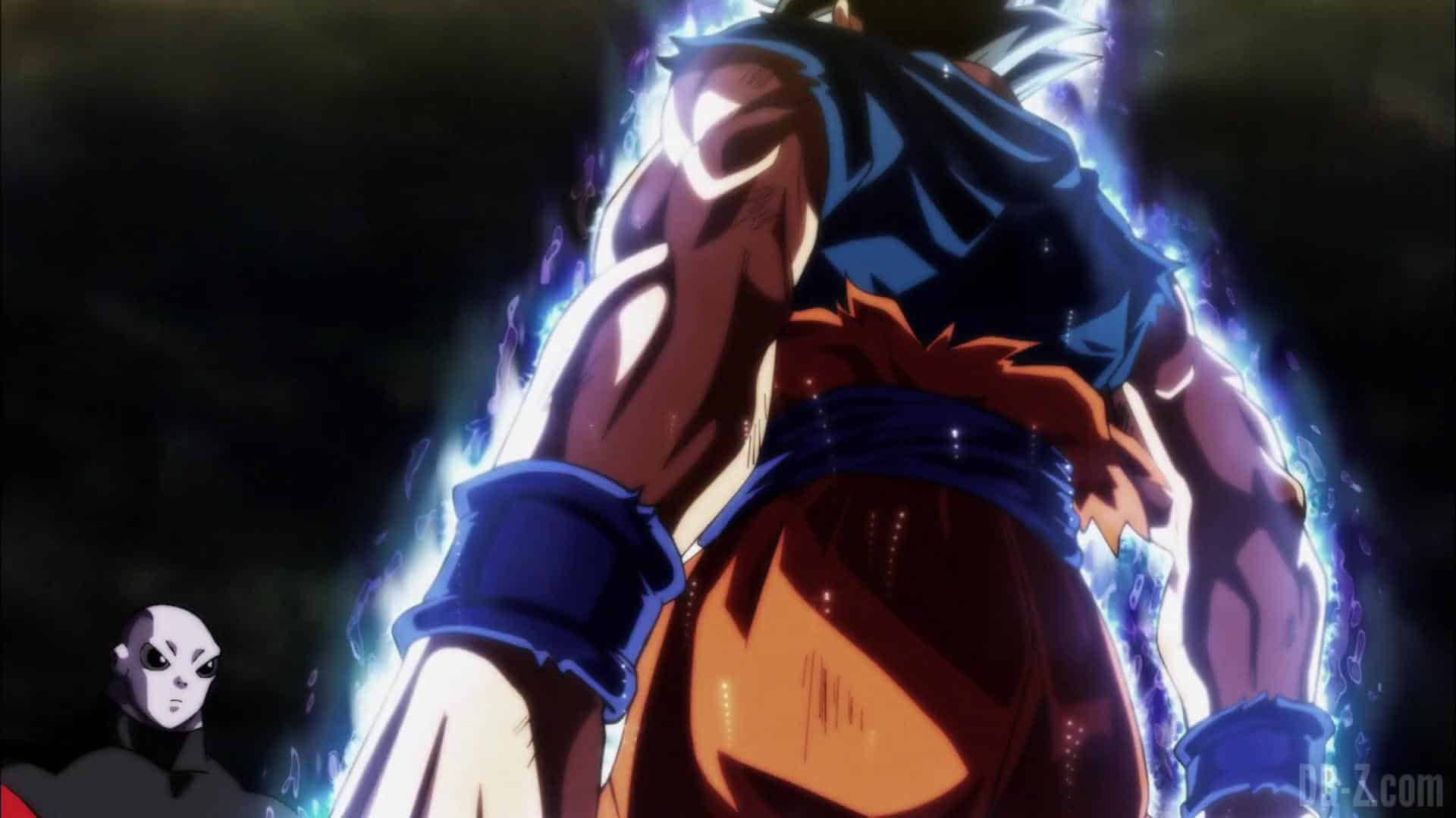 Ultra Instinct Goku 桌布 壁紙 — 一個強大的動漫戰士散發出藍色能量，而一個臉色蒼白的身影從陰影中注視著。