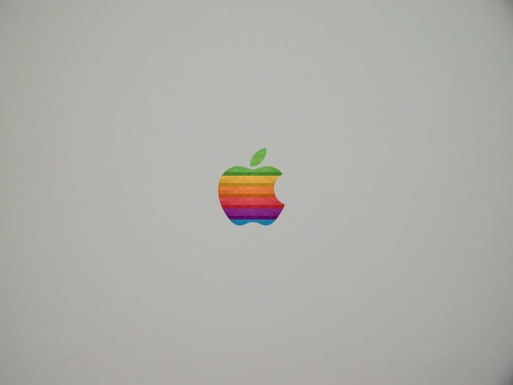 桌布 壁紙 — 一個復古彩虹Apple標誌，位於純淺灰色筆記型電腦蓋中央。