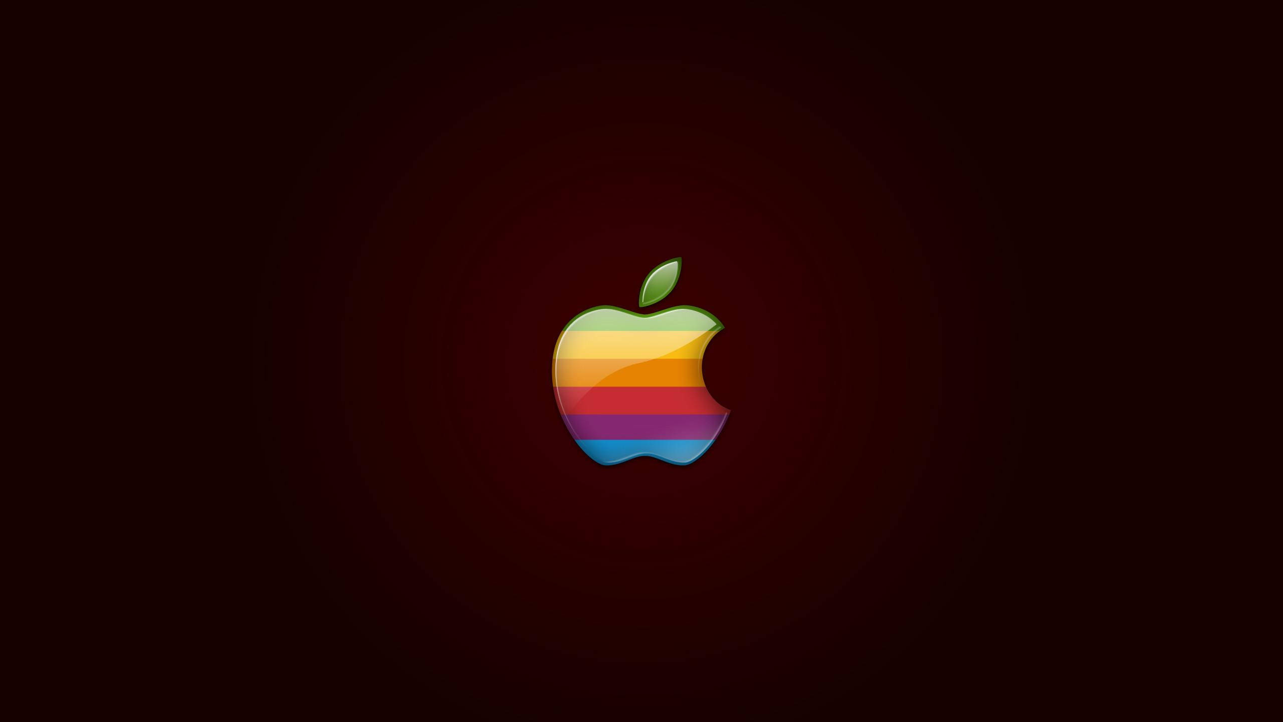 4K 桌布 壁紙 — 一個復古彩虹Apple標誌，居中在深紅色漸變背景上，帶有微妙的同心圓。