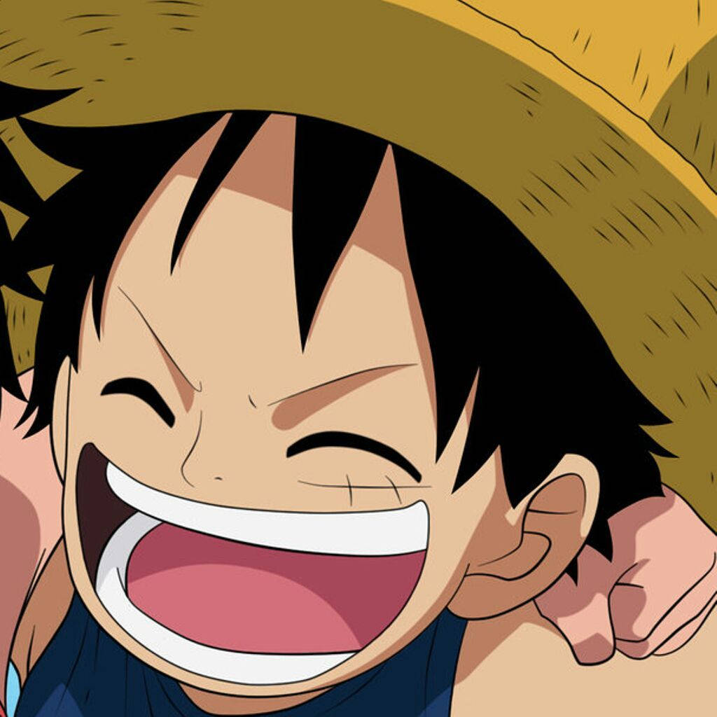 Luffy 桌布 壁紙 — 一個快樂的動漫男孩，黑髮戴草帽，緊閉雙眼開懷大笑。