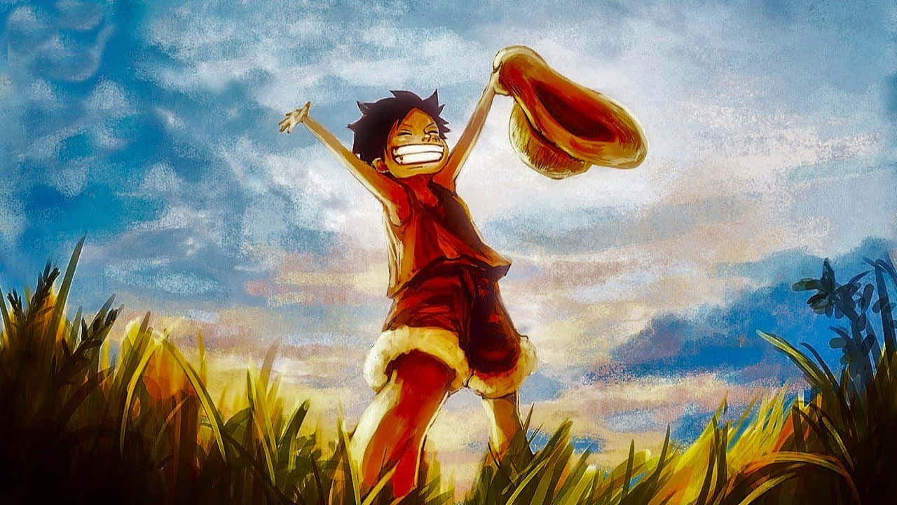 海賊王 桌布 壁紙 — 一個快樂的動漫男孩穿著紅色衣服，在陰天的高草叢中跳躍，雙臂高舉，帽子高高拋起。