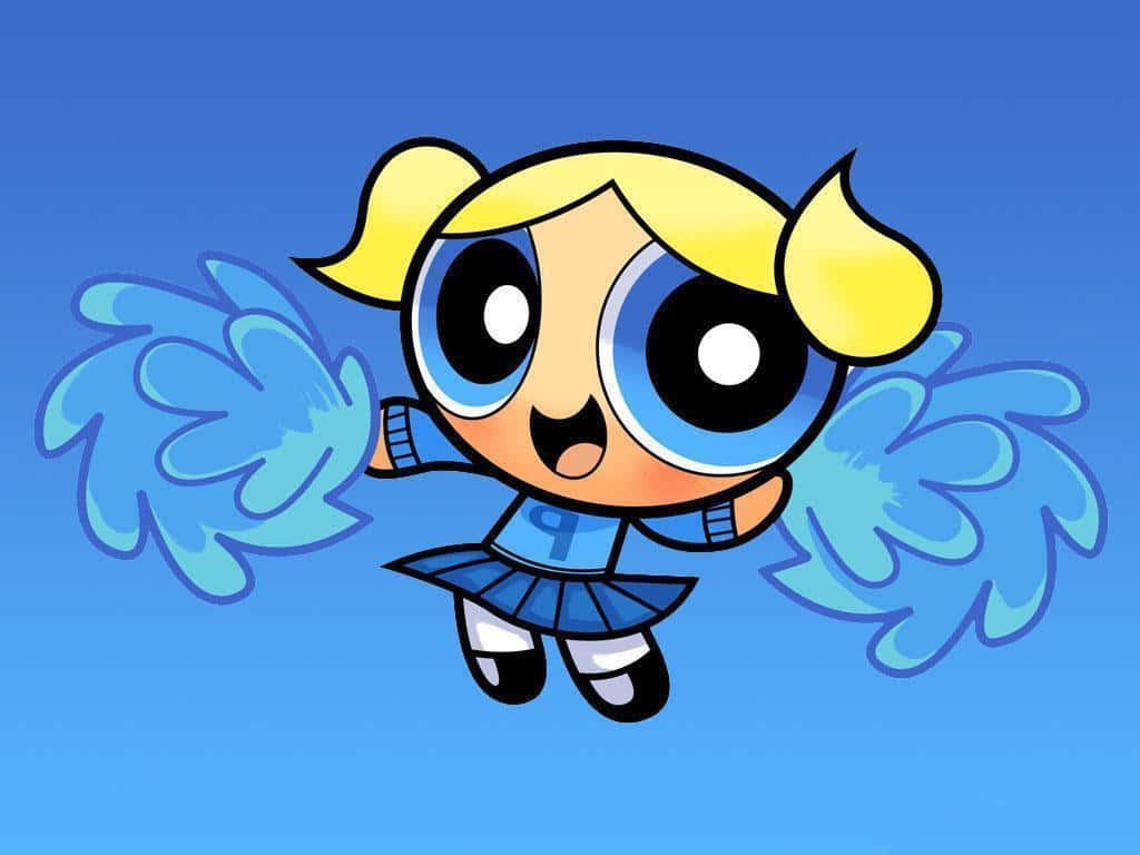 Powerpuff Girls 桌布 壁紙 — 一個快樂的卡通啦啦隊隊長，金色雙馬尾，藍色絨球，漂浮在純藍色背景上。