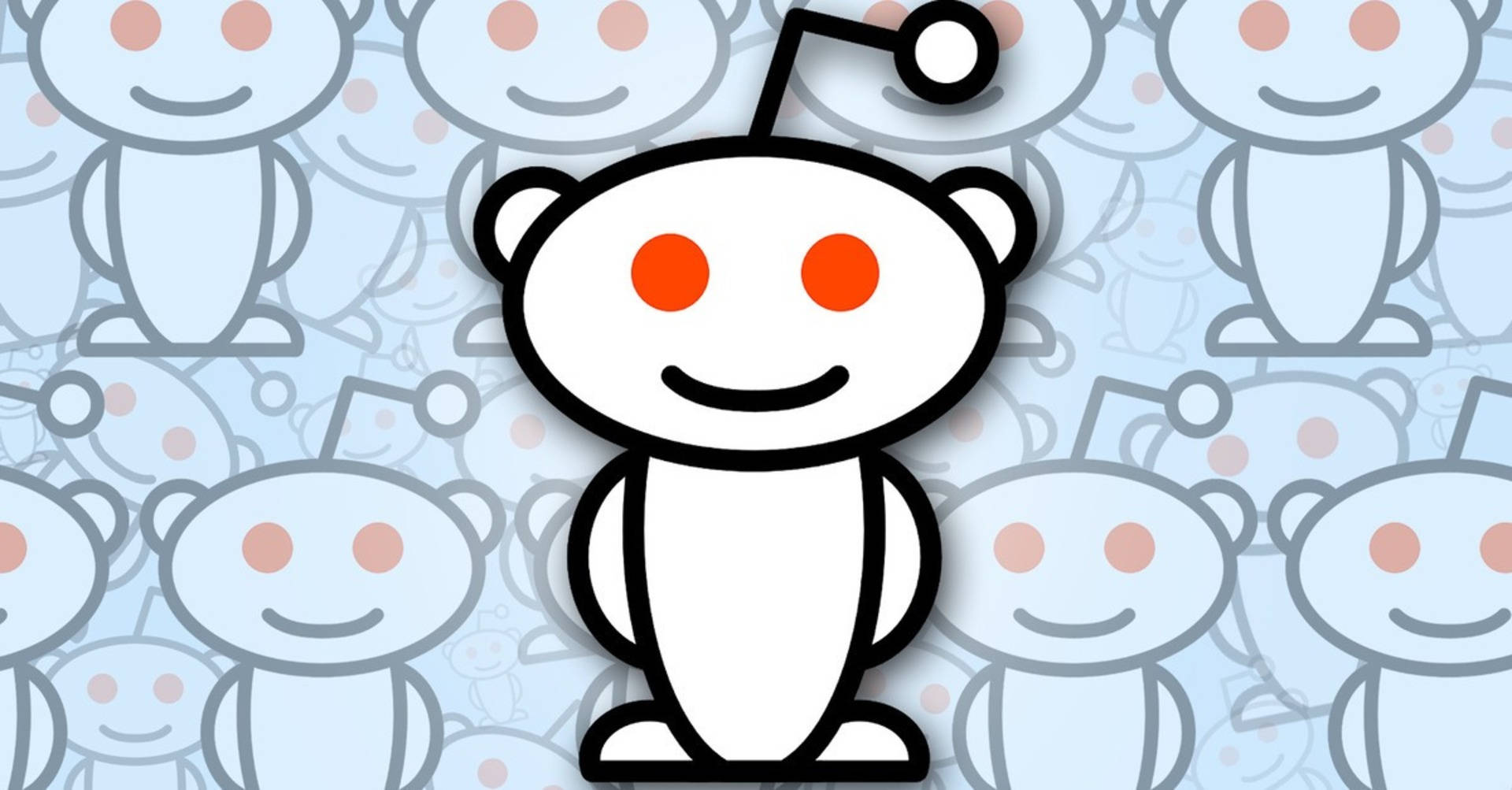 Reddit 桌布 壁紙 — 一個快樂的白色外星人吉祥物，有橙色眼睛和天線，在重複的淡藍色自身圖案中脫穎而出。