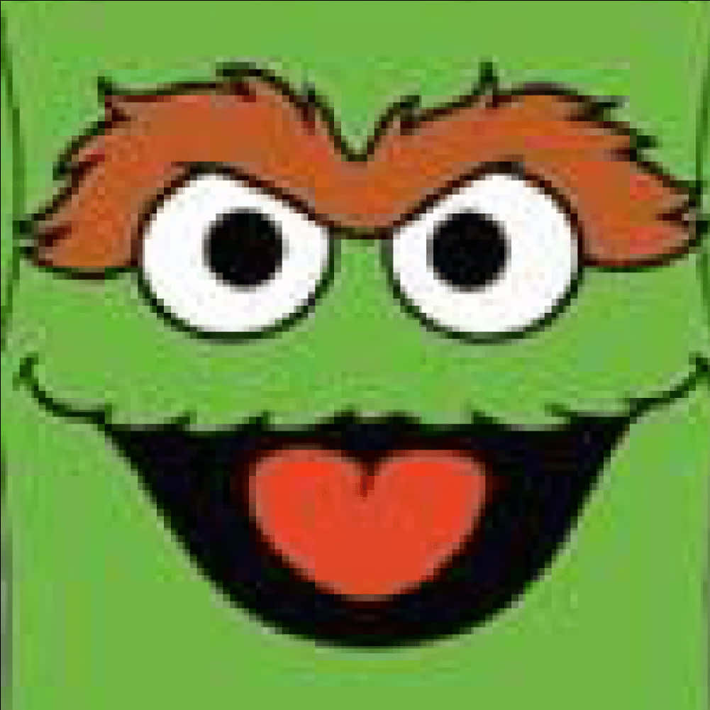 muppets 桌布 壁紙 — 一個快樂的綠色卡通角色，有橙色頭髮、大眼睛和伸出的心形舌頭，背景是純綠色。