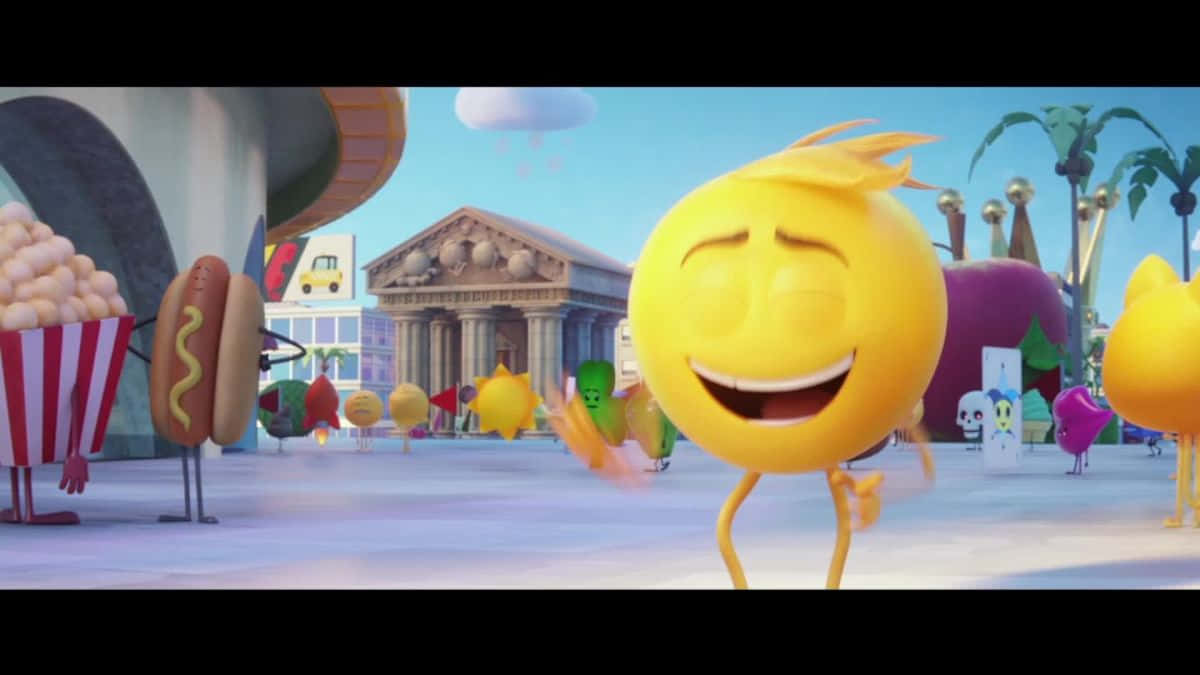 Animated Cartoon 桌布 壁紙 — 一個快樂的黃色笑臉表情符號角色在充滿擬人化食物的生動動畫城市景觀中跳舞。