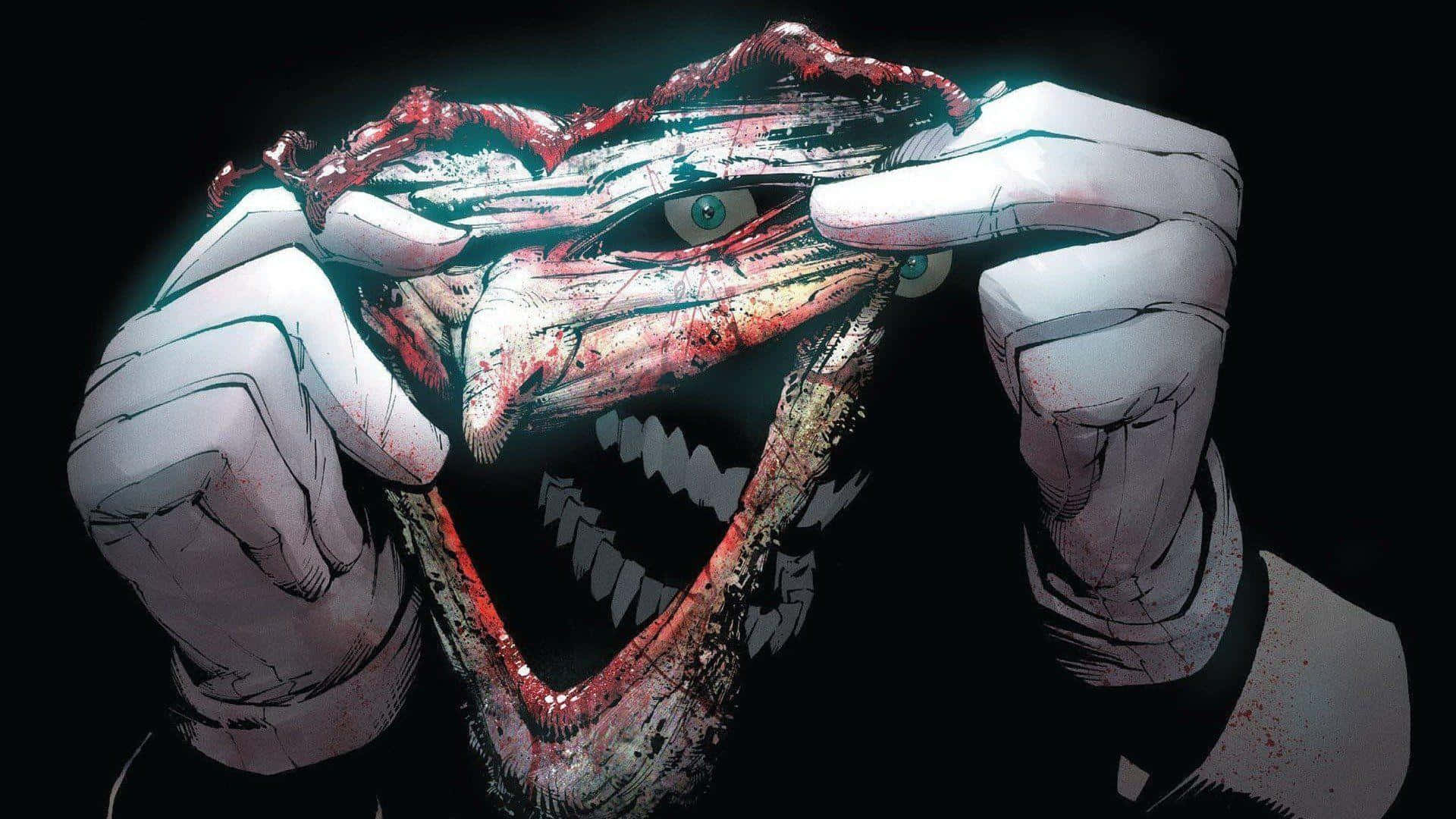 Batman Death In The Family 桌布 壁紙 — 一個怪誕、血淋淋的臉孔帶著咧嘴笑，被戴手套的手在黑色背景前拉開。