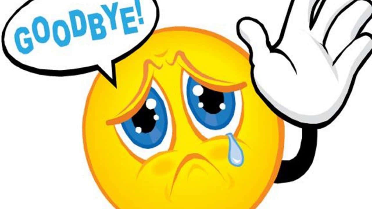 Goodbye 桌布 壁紙 — 一個悲傷的黃色卡通表情符號揮手告別，眼淚順著臉頰流下，對話框寫著再見。