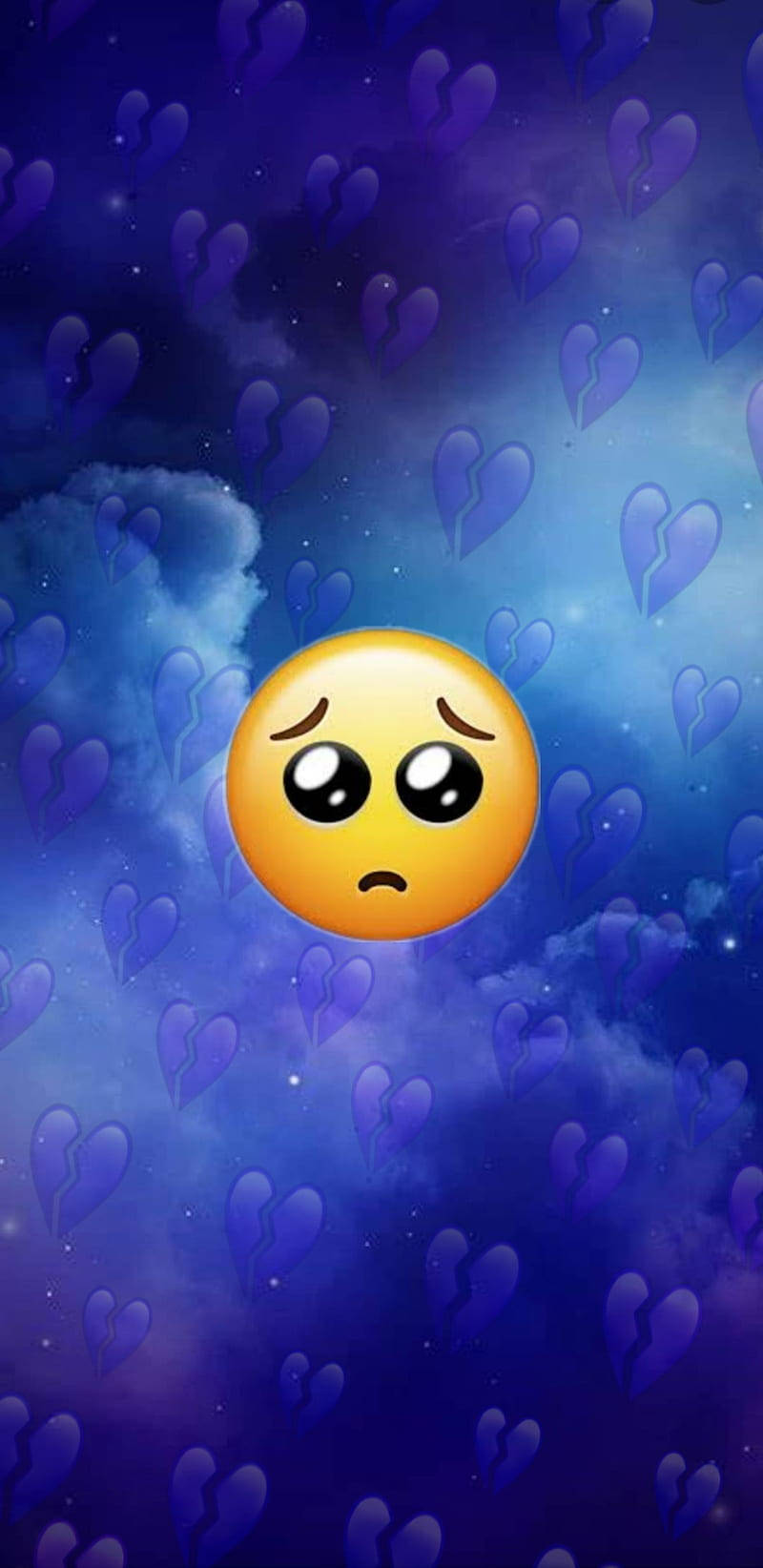 Broken Heart 桌布 壁紙 — 一個悲傷的黃色表情符號漂浮在充滿破碎紫色愛心和漩渦雲層的宇宙天空中。