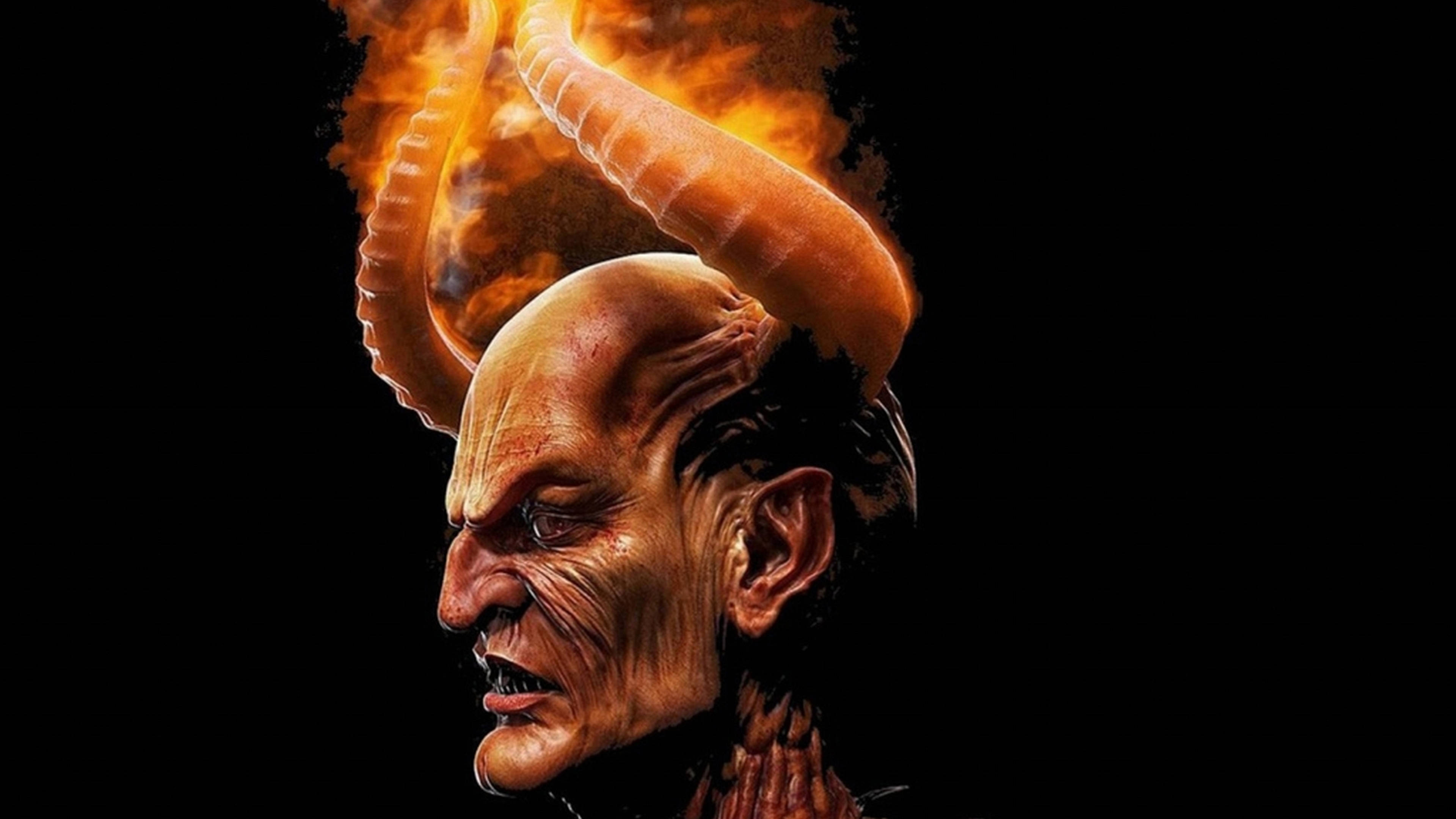 horns 桌布 壁紙 — 一個惡魔般的身影，有著火焰般的角和皺紋的皮膚，在黑色背景下怒目而視。
