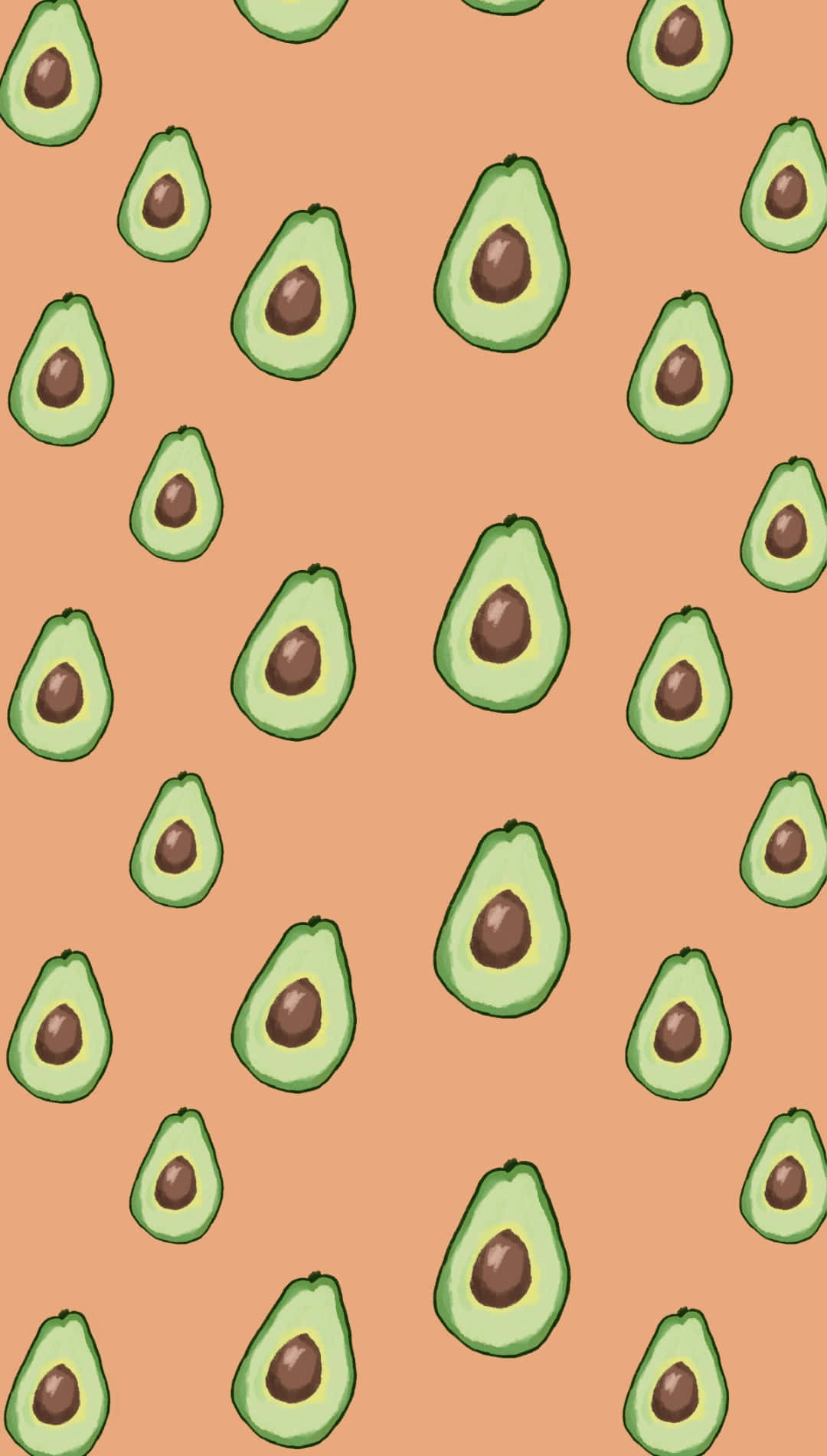 Cute Avocado 桌布 壁紙 — 一個愉快的圖案，切片酪梨帶有棕色果核散落在溫暖的桃色背景上。