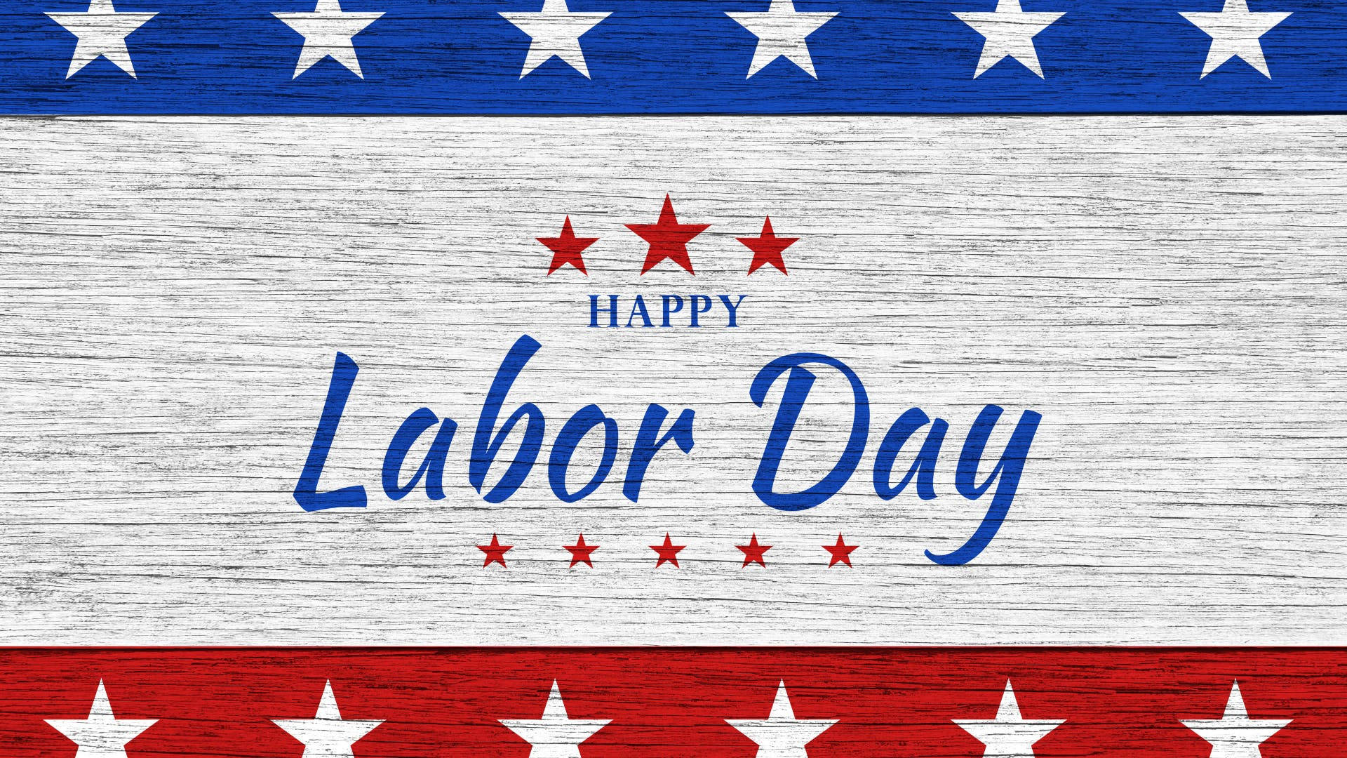 Labor 桌布 壁紙 — 一個愛國的勞動節問候，帶有粗體藍色文字和紅白星星，背景是風化的木質。