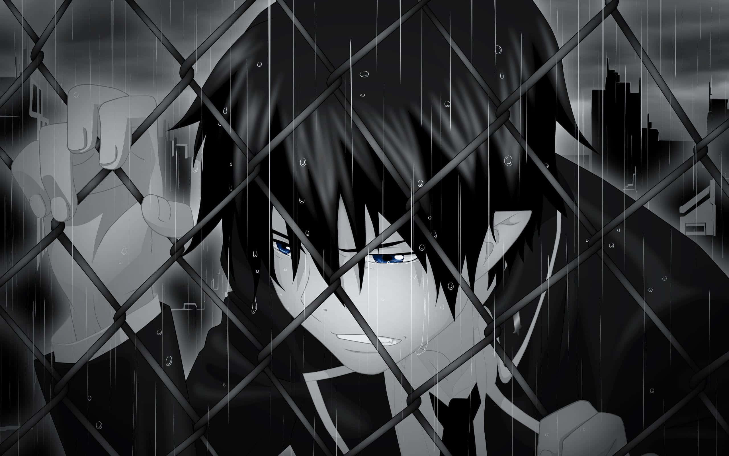 Dark Emotional 桌布 壁紙 — 一個憂鬱的動漫角色，藍色眼睛，在陰暗的城市環境中壓向被雨水浸濕的鐵絲網圍欄。