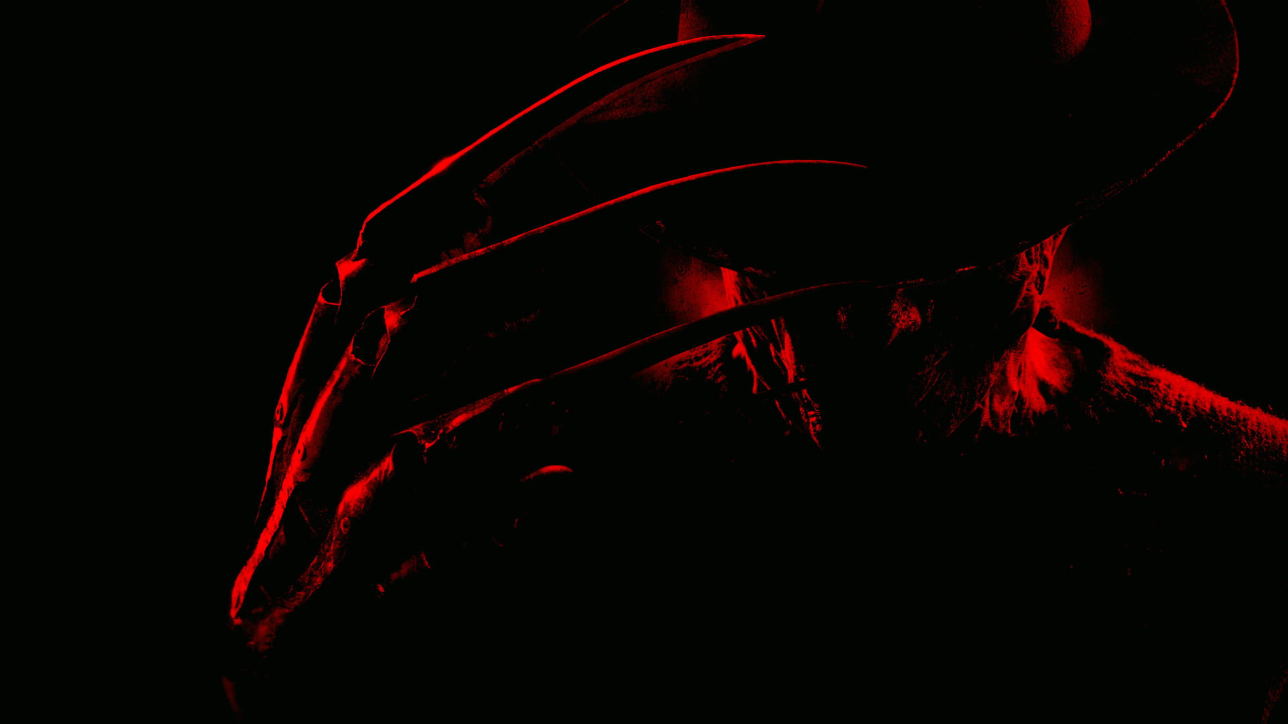 Freddy 桌布 壁紙 — 一個戴帽子和手套的可怕人物在黑暗中呈現剪影，被詭異的紅光照亮。