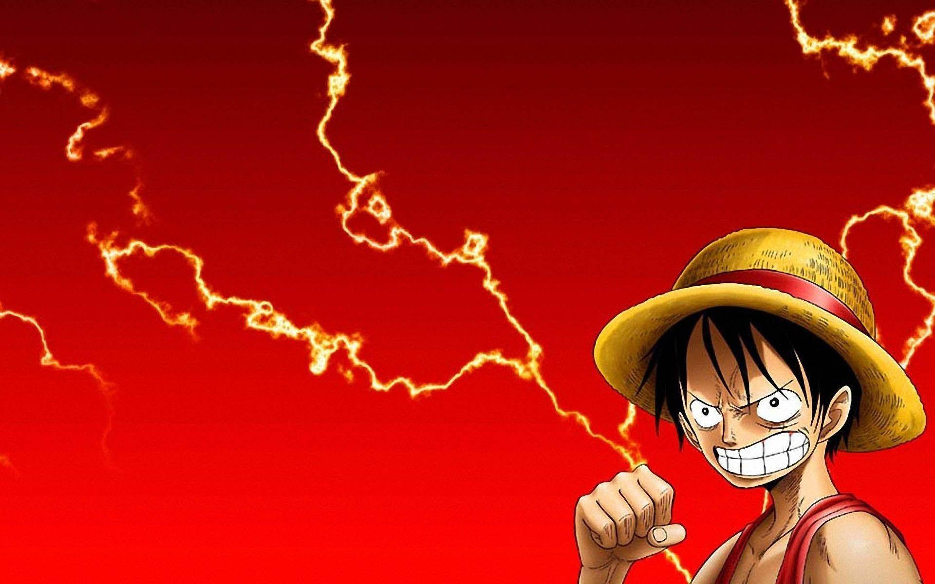 Luffy 桌布 壁紙 — 一個戴草帽的決心動畫男孩，在火紅背景和劈啪作響的閃電中緊握拳頭。