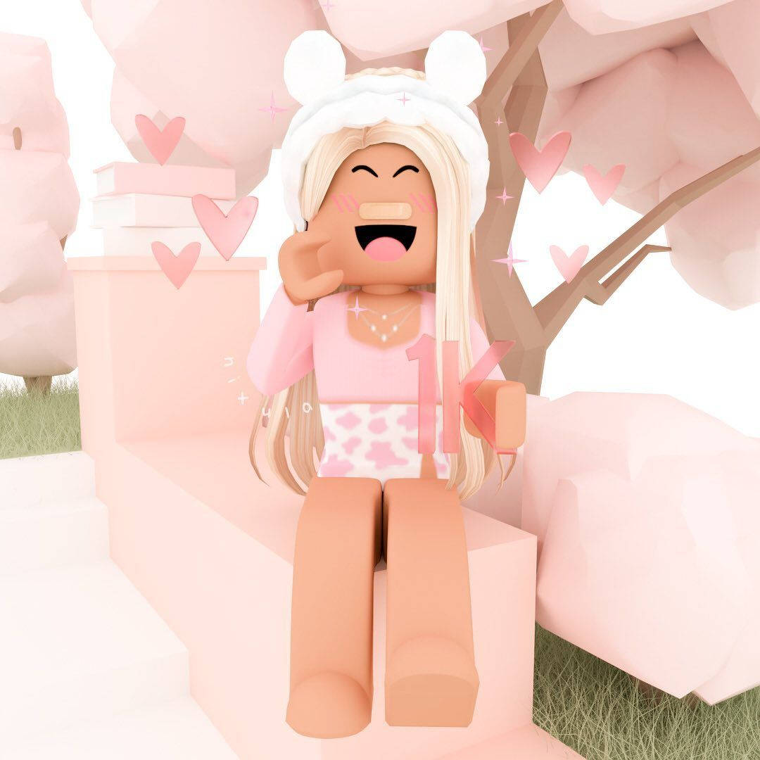 美學 Roblox 女孩 桌布 壁紙 — 一個戴著兔耳的開心Roblox頭像在粉紅色櫻花場景中，伴隨著漂浮的心形，開心地笑。
