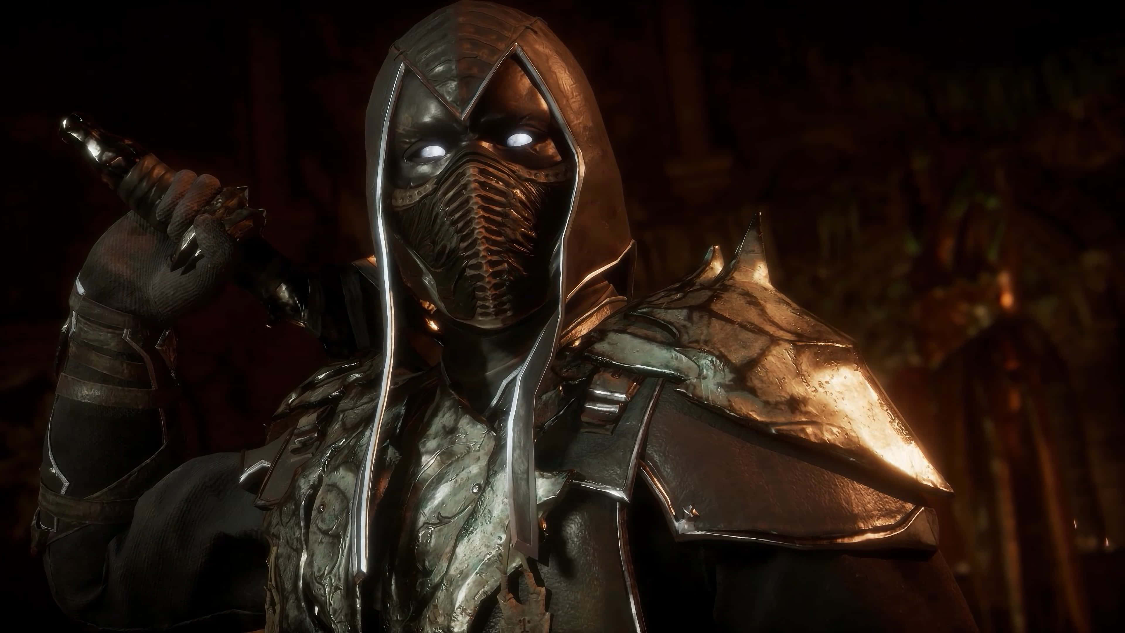 Mortal Kombat Noob Saibot 桌布 壁紙 — 一個戴著兜帽、眼神發光、身穿華麗盔甲的威嚇戰士，在昏暗的地牢中手持武器。