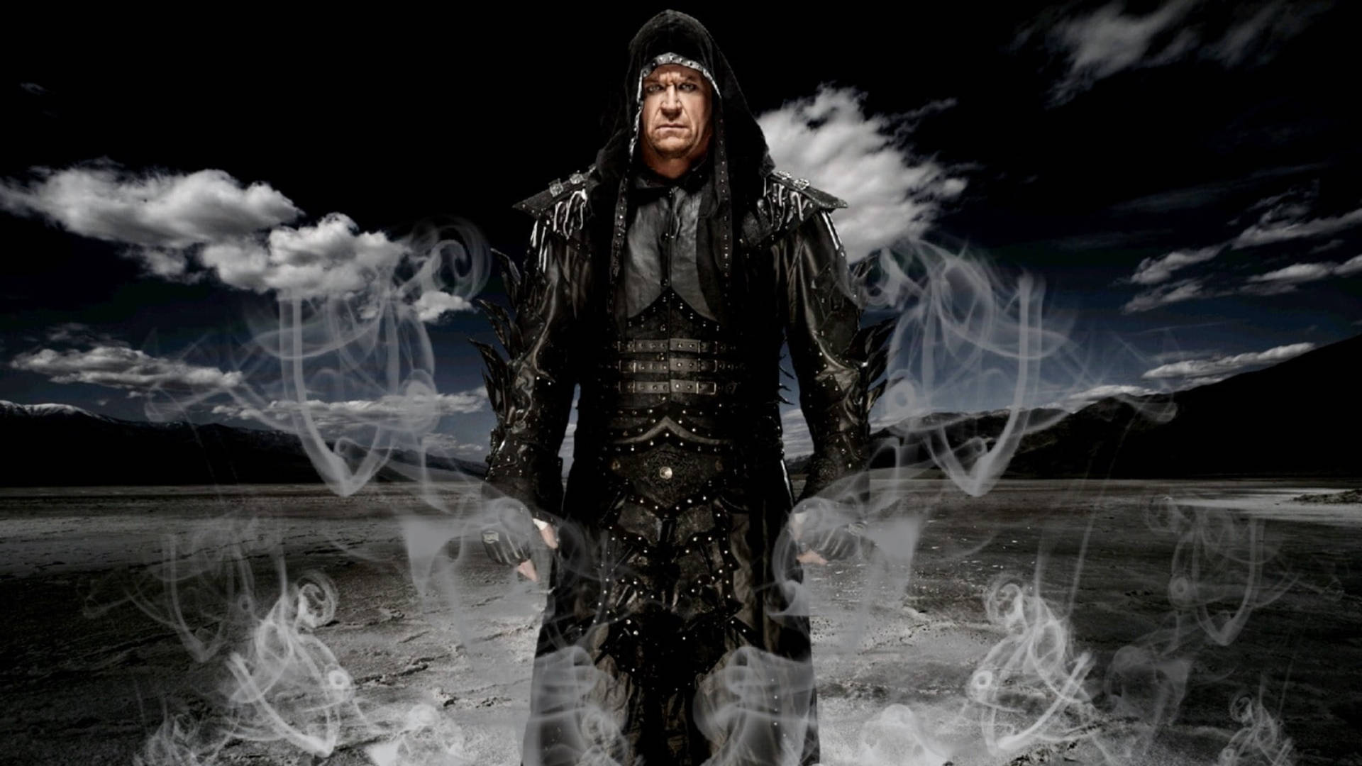 Undertaker 桌布 壁紙 — 一個戴著兜帽、身穿華麗黑色盔甲的威脅人物站在荒蕪的廢土上，頭頂有旋轉的煙霧和戲劇性的雲層。