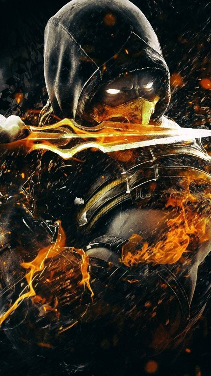 Mk11 桌布 壁紙 — 一個戴著兜帽的戰士，雙眼發光，在旋轉的餘燼和黑煙中揮舞著一把火焰劍。