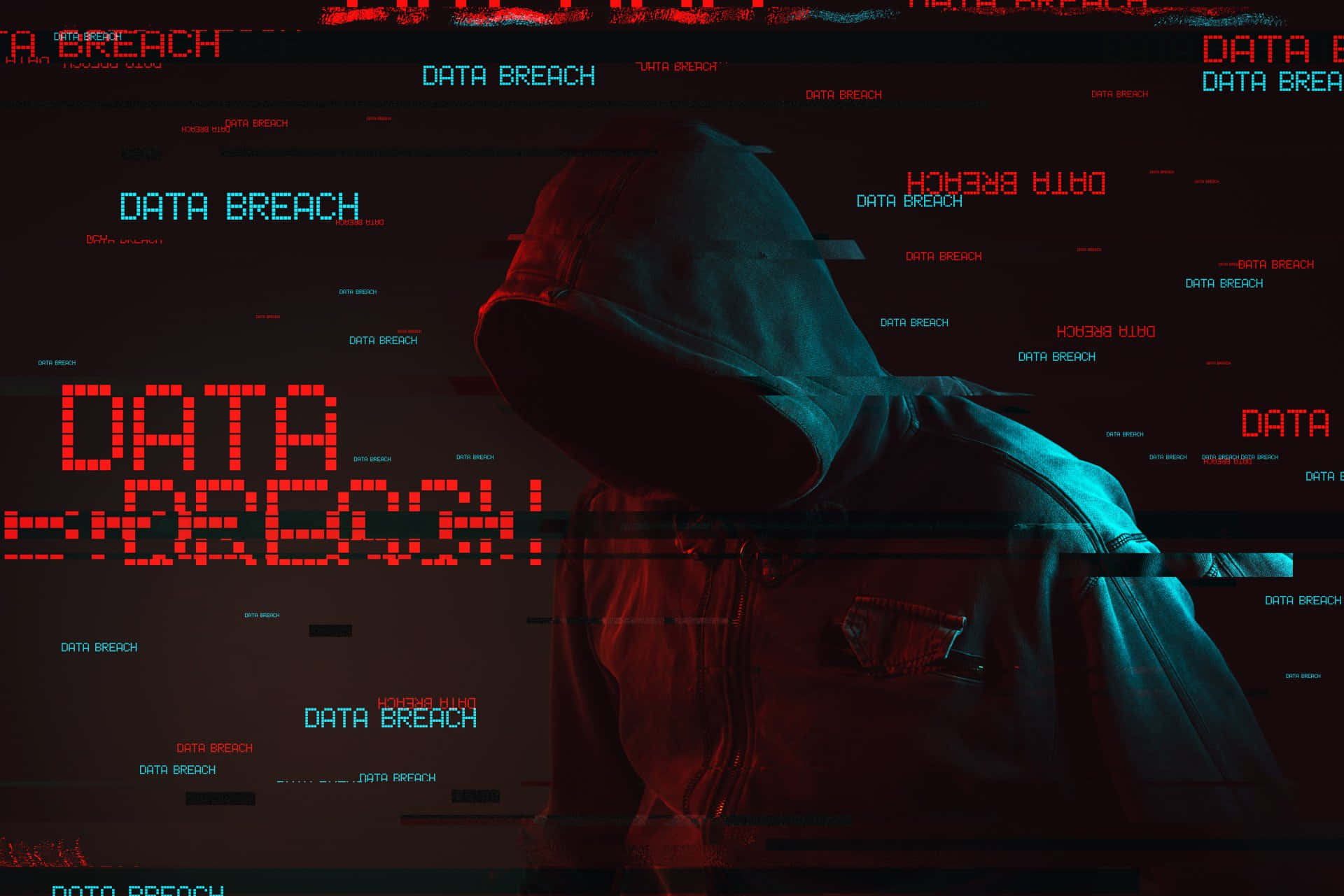 Anamous 壁紙 — 一個戴著兜帽的身影站在一個充滿發光紅色和藍色「DATA BREACH」文字和數位故障的黑暗螢幕前。