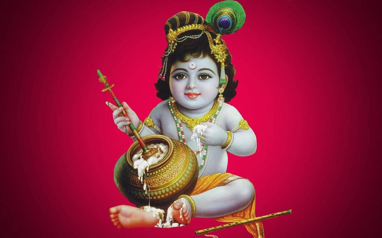 Bal Krishna 桌布 壁紙 — 一個戴著孔雀羽毛皇冠的神聖小孩在鮮紅色背景前從金色壺中倒出牛奶。