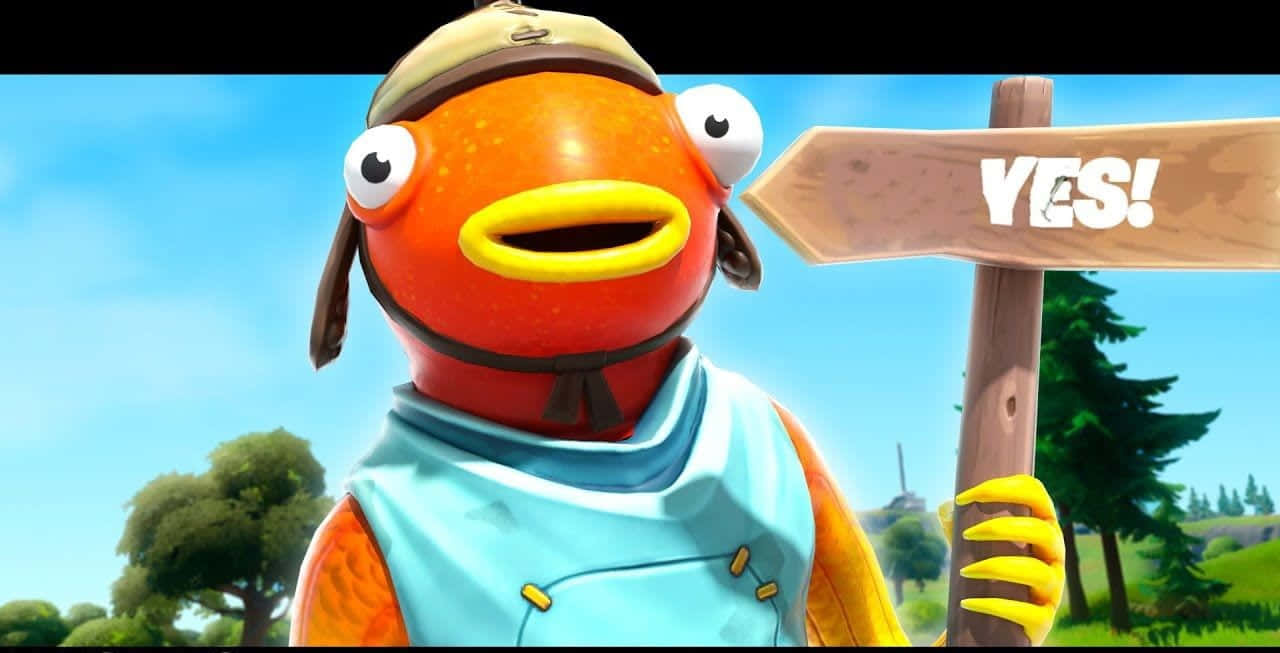 Fishstick 桌布 壁紙 — 一個戴著帽子和背心的快樂橙色魚角色拿著一個寫著「是！」的木牌。