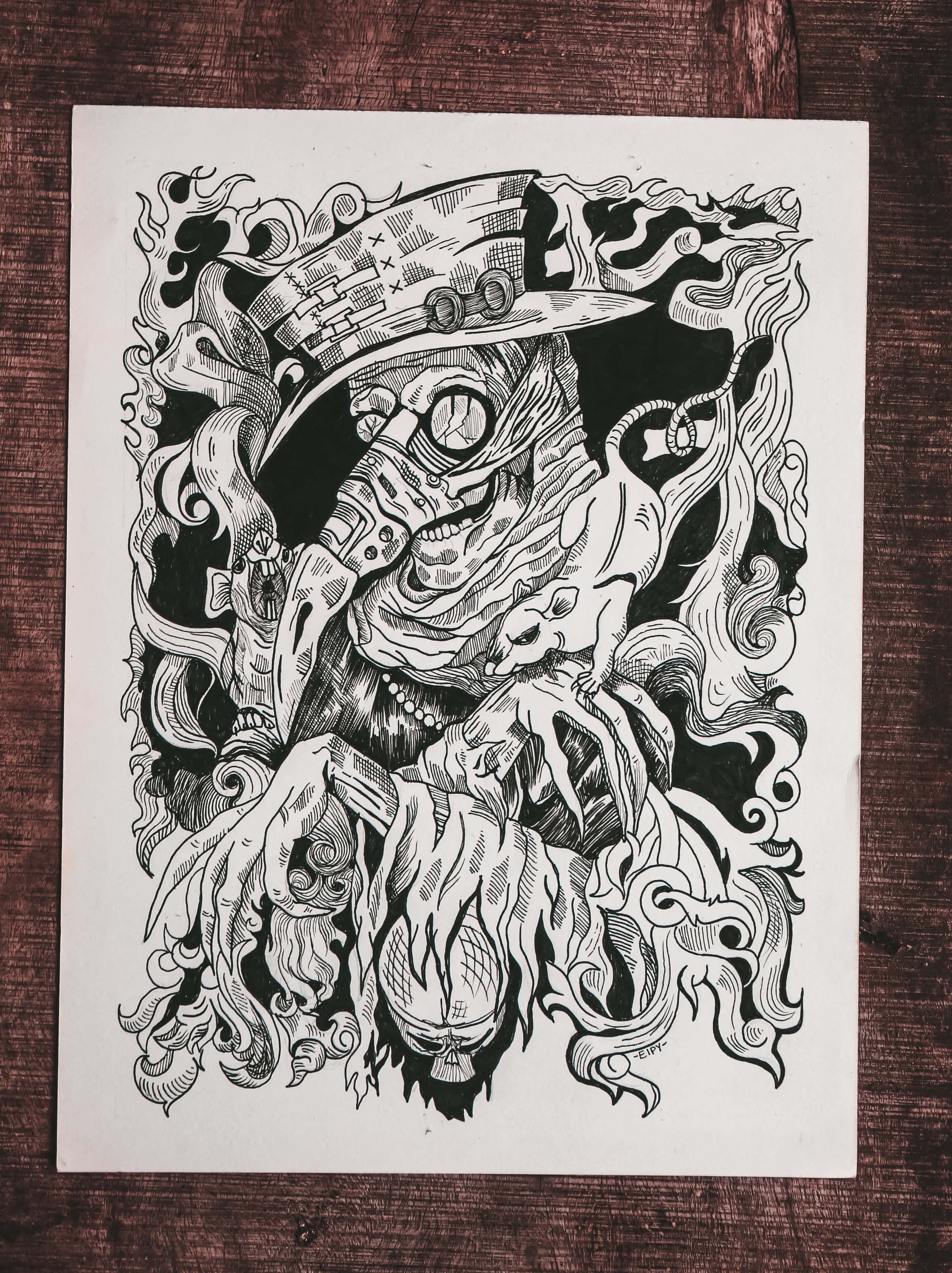 Drawing 桌布 壁紙 — 一個戴著帽子的怪誕生物的詳細黑白插圖，帶有漩渦圖案和骨骼特徵，位於木質表面上。