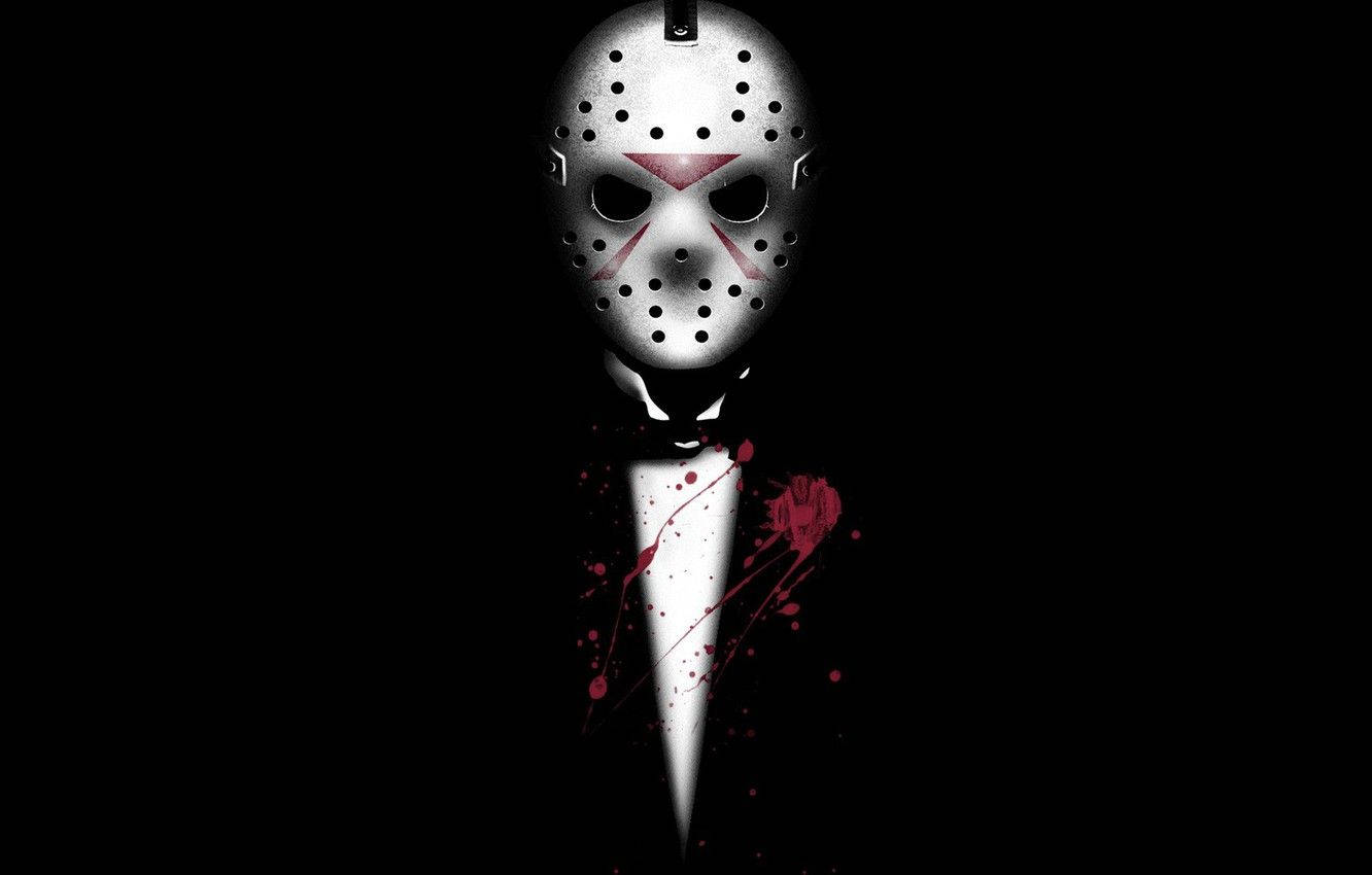 jason 桌布 壁紙 — 一個戴著曲棍球面具、身穿燕尾服、帶有血跡的可怕人物，背景為黑色。