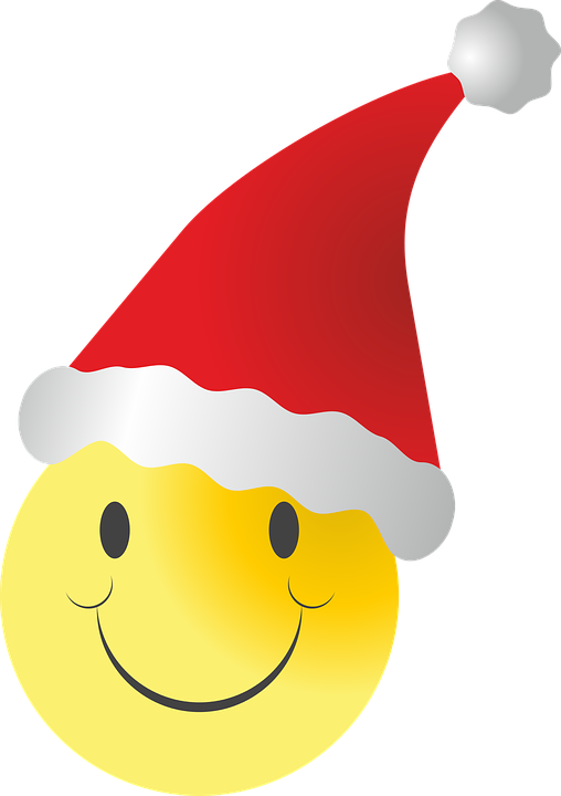 Smiley 桌布 壁紙 — 一個戴著紅色聖誕帽（白色邊緣和絨球）的快樂黃色笑臉。