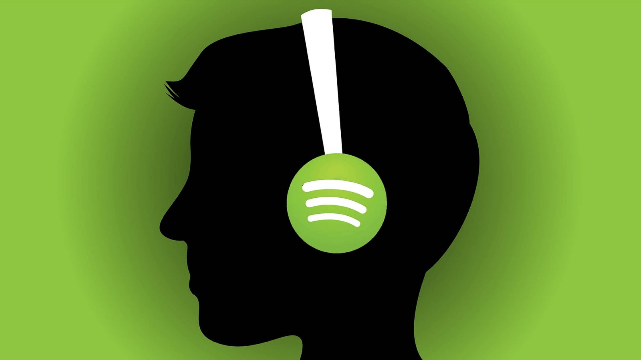 Spotify 桌布 壁紙 — 一個戴著耳機的人的剪影，耳罩上有Spotify標誌，背景是充滿活力的綠色漸變。