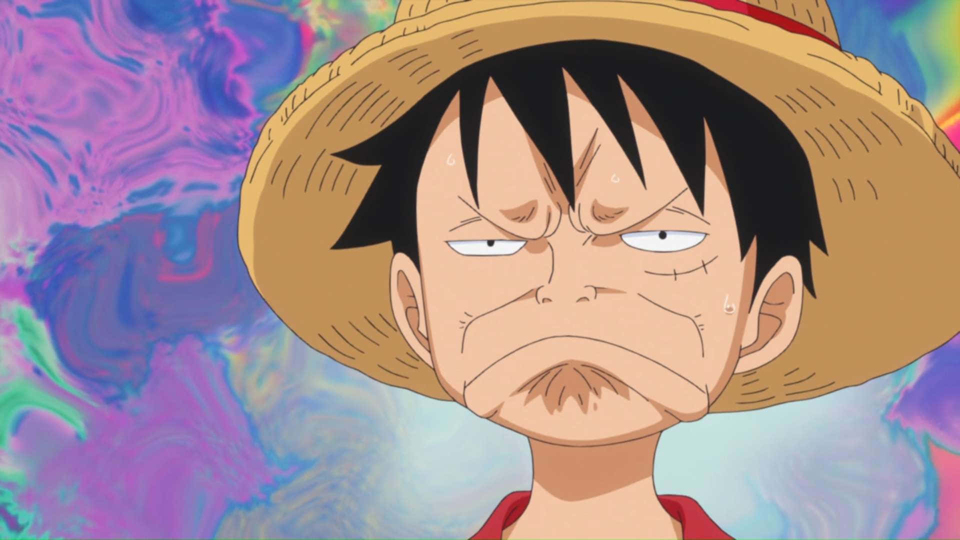 Luffy 桌布 壁紙 — 一個戴著草帽的堅定動畫男孩，在旋轉的迷幻背景前做鬼臉。