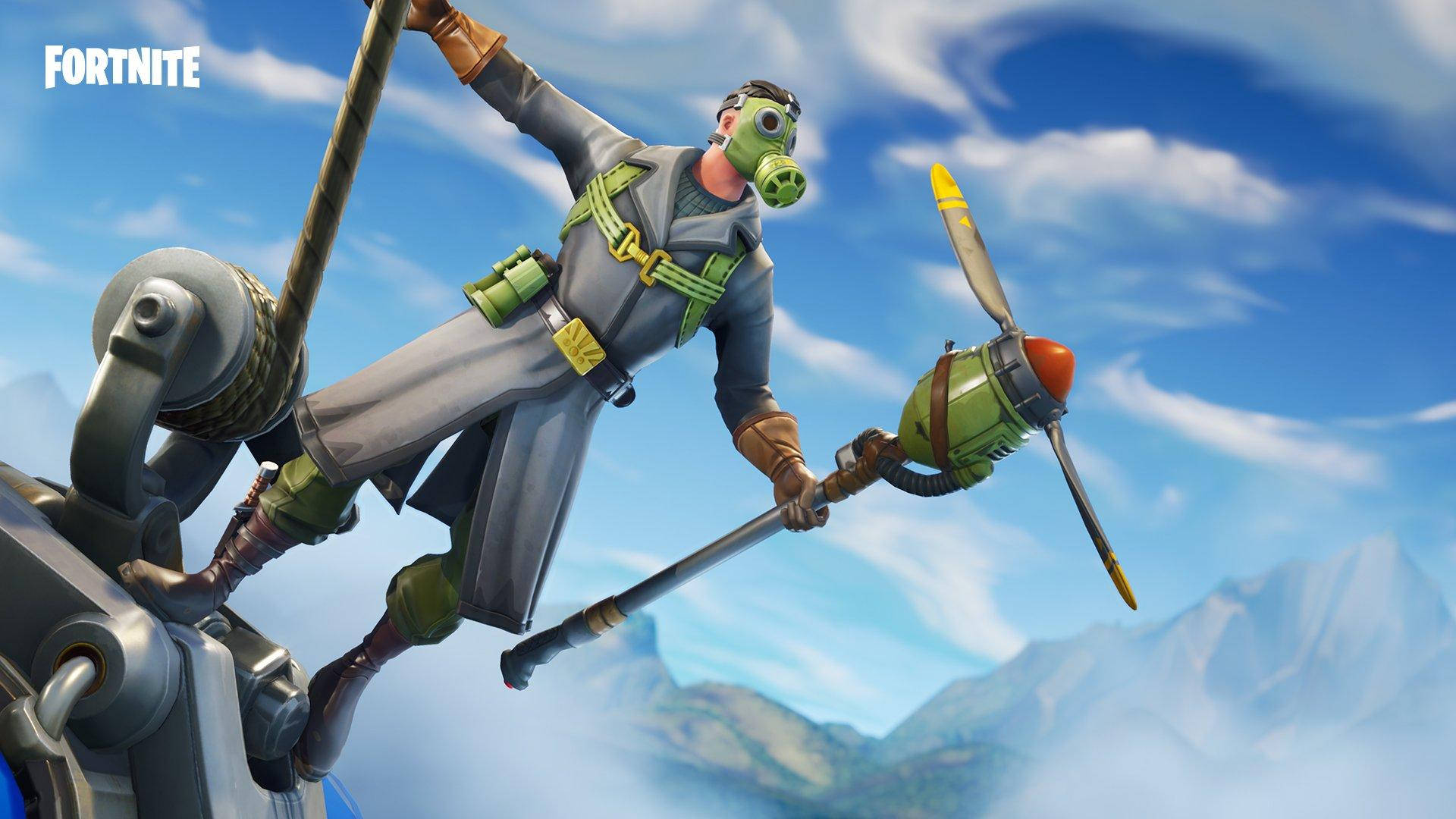 Fortnite 桌布 壁紙 — 一個戴著防毒面具、身穿灰色西裝的Fortnite角色，在藍天白雲和遠山的背景下，從一個機械裝置上懸掛著。