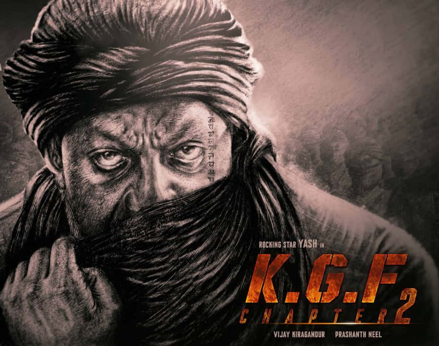 Kgf Chapter 2 桌布 壁紙 — 一個戴著頭巾和圍巾遮住嘴巴的男人，臉上帶有疤痕和刺青，眼神強烈地凝視著鏡頭。