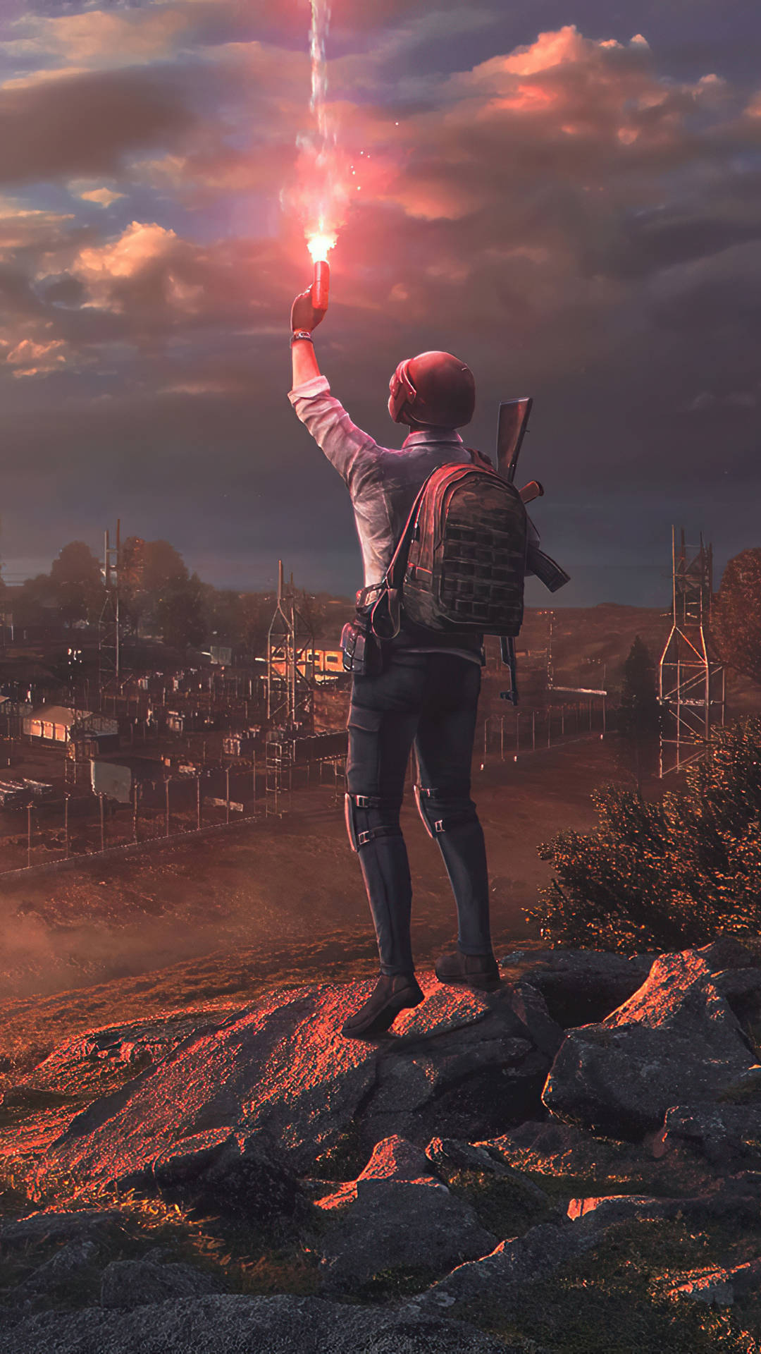 一個遊戲角色在黃昏時分的岩石山上手持信號火炬。 — PUBG 4K 壁紙 壁紙