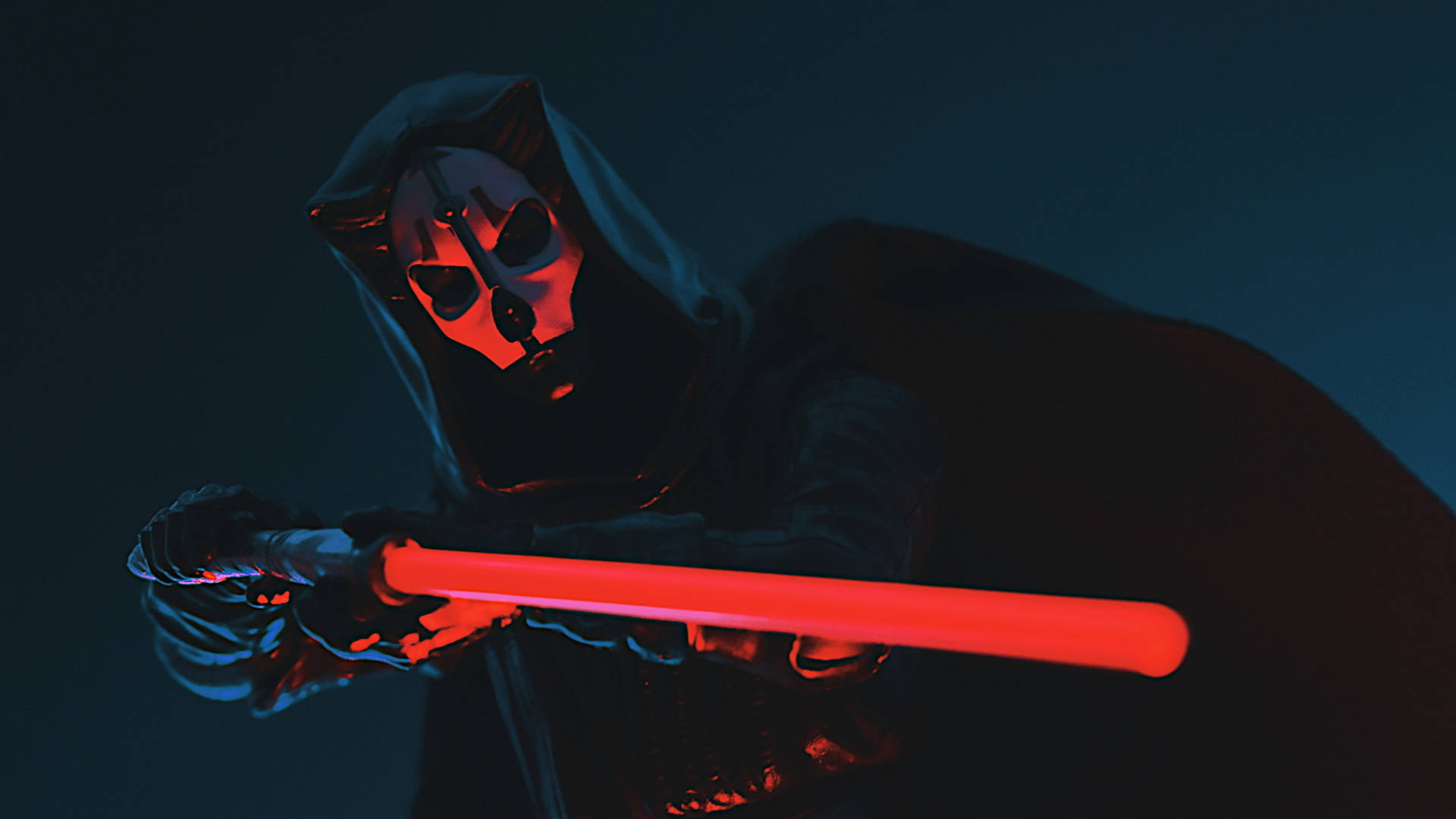 Darth Nihilus 桌布 壁紙 — 一個戴著頭骨面具的兜帽人物在深藍色背景上揮舞著發光的紅色光劍。