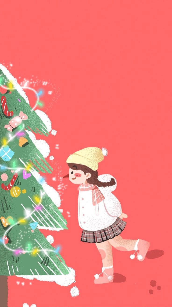 可愛聖誕 iPhone 桌布 壁紙 — 一個戴著黃色帽子和白色外套的開朗女孩，在珊瑚粉紅色背景前，旁邊是一棵裝飾著彩色飾品的明亮聖誕樹，她正在跳舞。