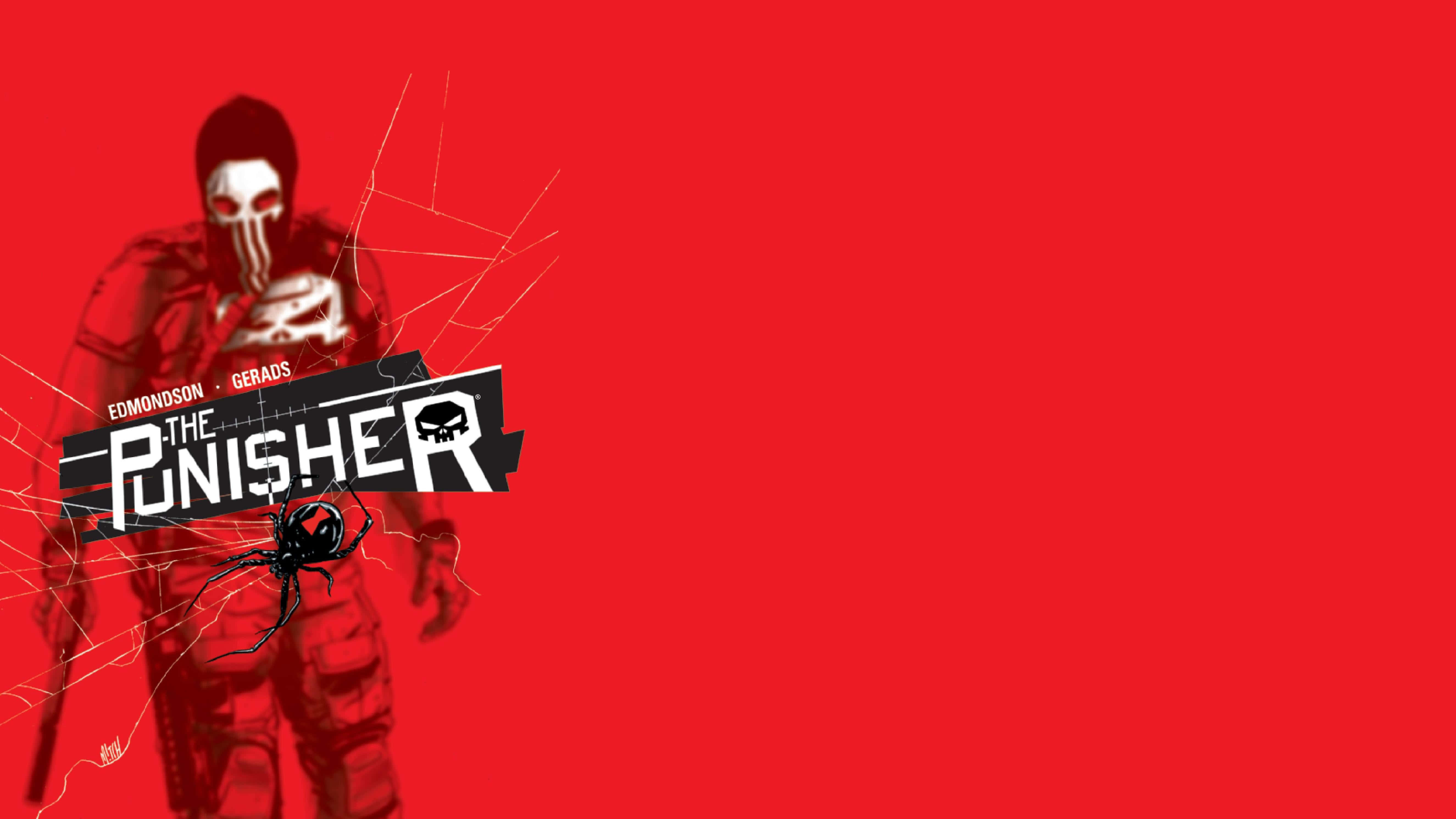 Punisher Desktop 桌布 壁紙 — 一個戴面具的義警穿著戰術裝備，站在大膽的紅色背景前，帶有蜘蛛網圖案和漫畫書標題文字。