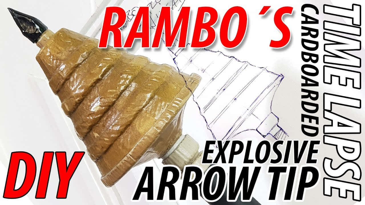 Arrow 桌布 壁紙 — 一個手工製作的紙板爆炸箭頭，用棕色膠帶包裹，放在帶有粗體紅色和黑色文字疊加的藍圖旁邊。