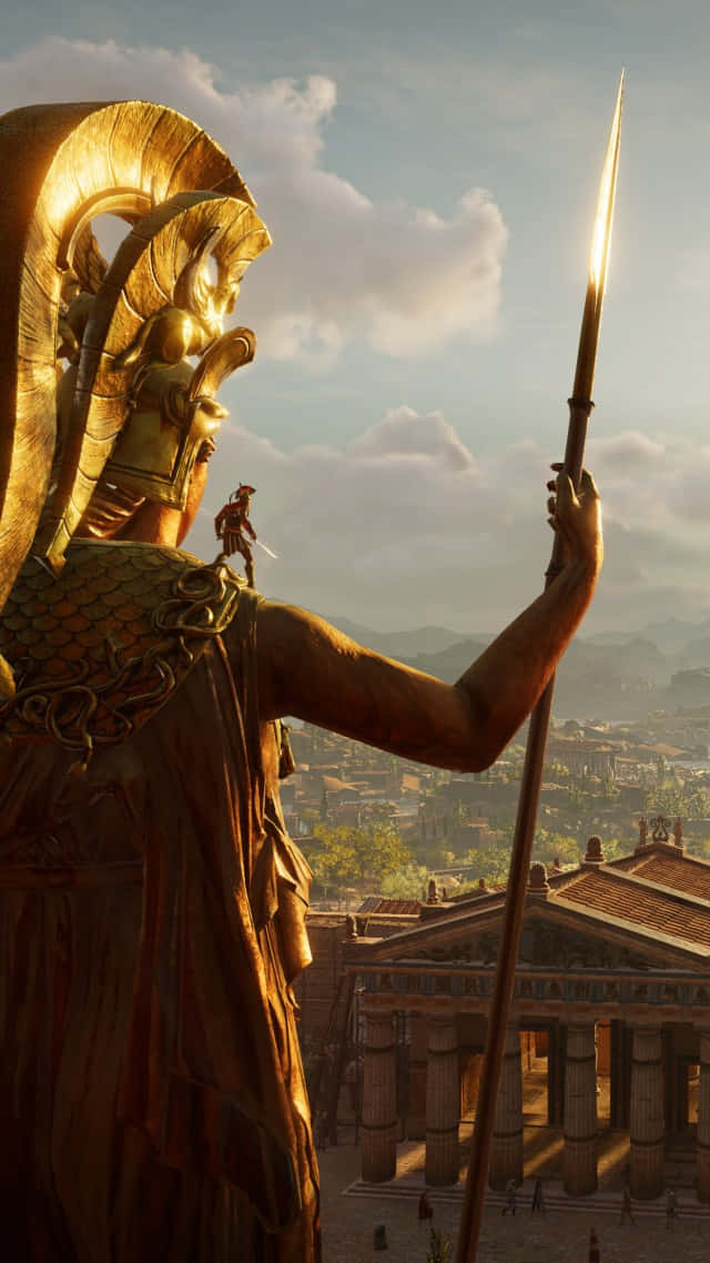 Android Assassin's Creed Odyssey 桌布 壁紙 — 一個手持長矛的戰士的巨大金色雕像俯瞰著日出時的古希臘城市景觀。