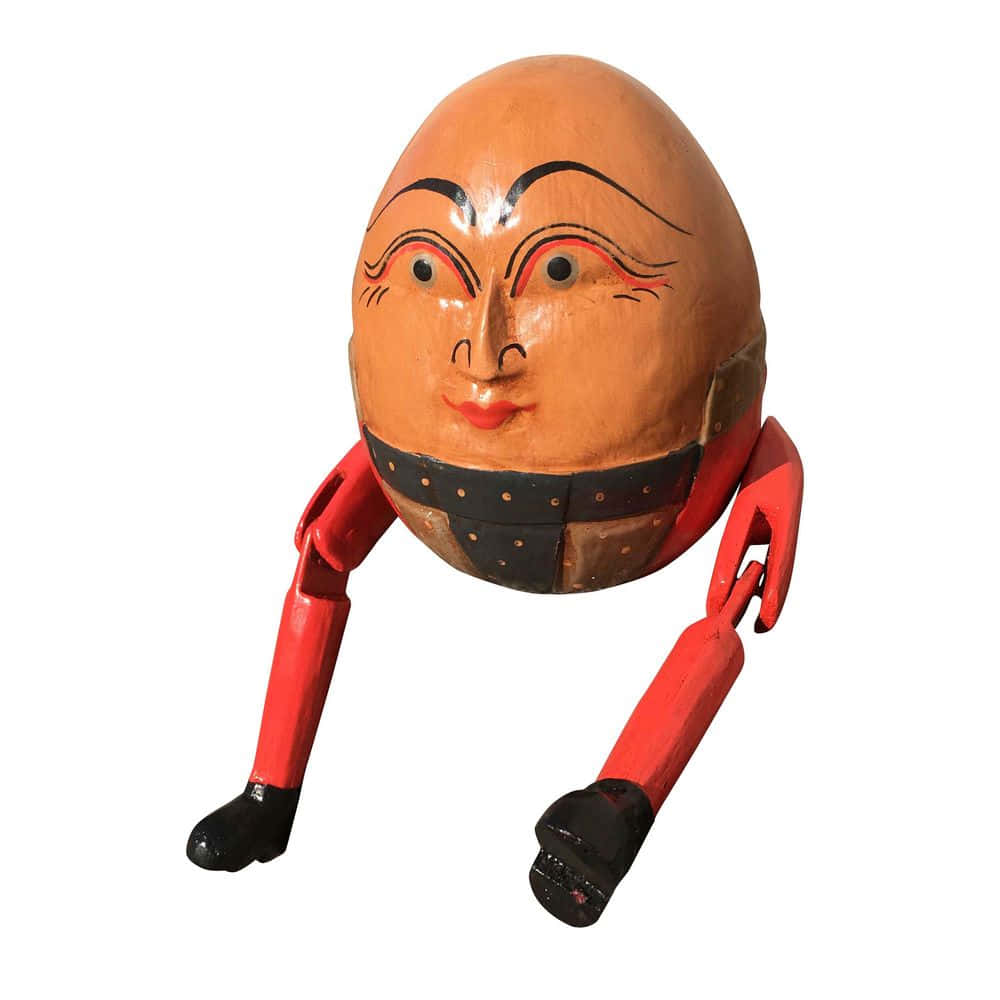 character 桌布 壁紙 — 一個手繪木製人偶，頭部呈蛋形，四肢紅色，蹲在白色背景前。