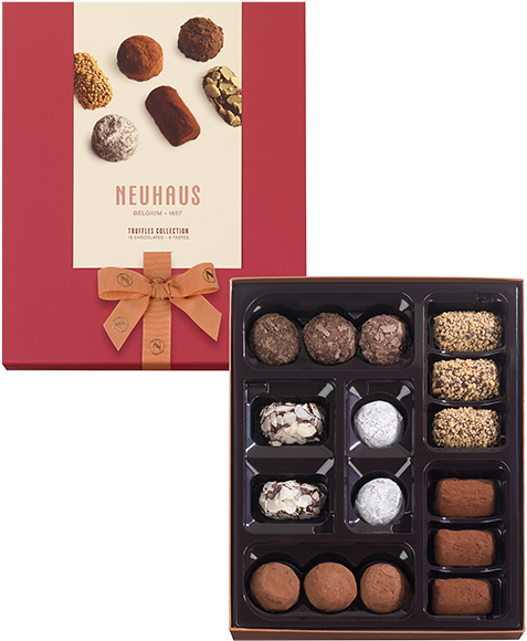 Chocolate 桌布 壁紙 — 一個打開的Neuhaus松露巧克力系列盒展示各種不同塗層和質地的巧克力，襯托著濃郁的紅色蓋子。