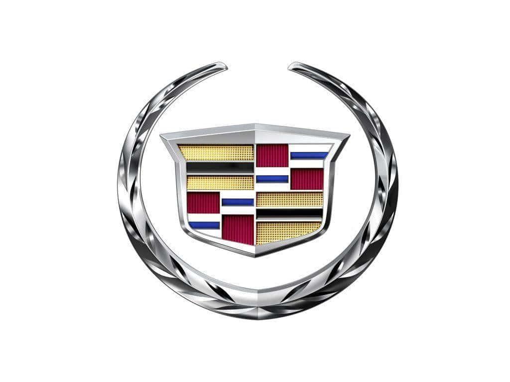 Cadillac 桌布 壁紙 — 一個拋光的凱迪拉克標誌，帶有鍍鉻花環環繞著一個帶有紅色、金色和藍色條紋的盾牌。
