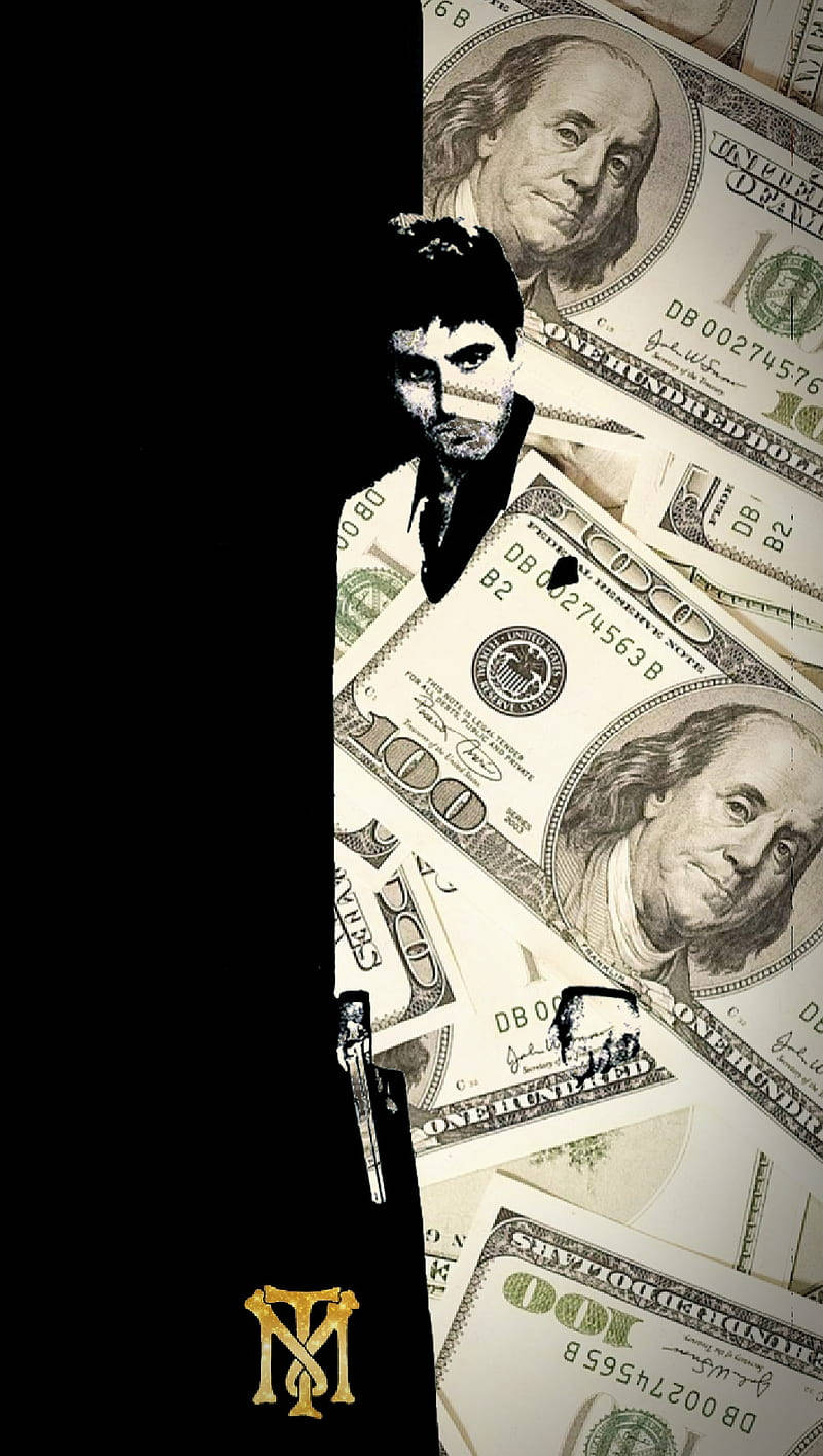 艾爾·帕西諾 疤面煞星 桌布 壁紙 — 一個持槍男人的鮮明剪影從黑暗中浮現，旁邊散落著百元美鈔。