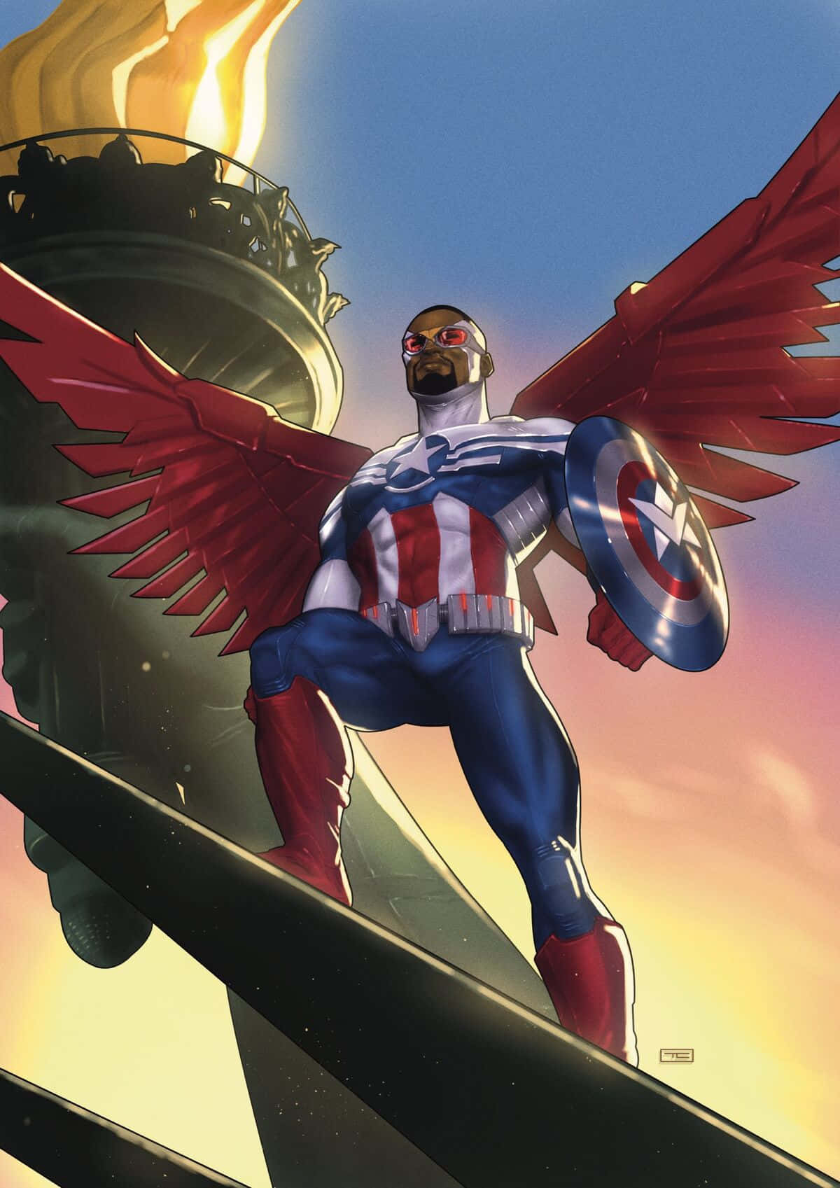 Marvel Logo 桌布 壁紙 — 一個擁有紅色翅膀的超級英雄站在自由女神像的火炬頂端，手持盾牌，背景是夕陽天空。