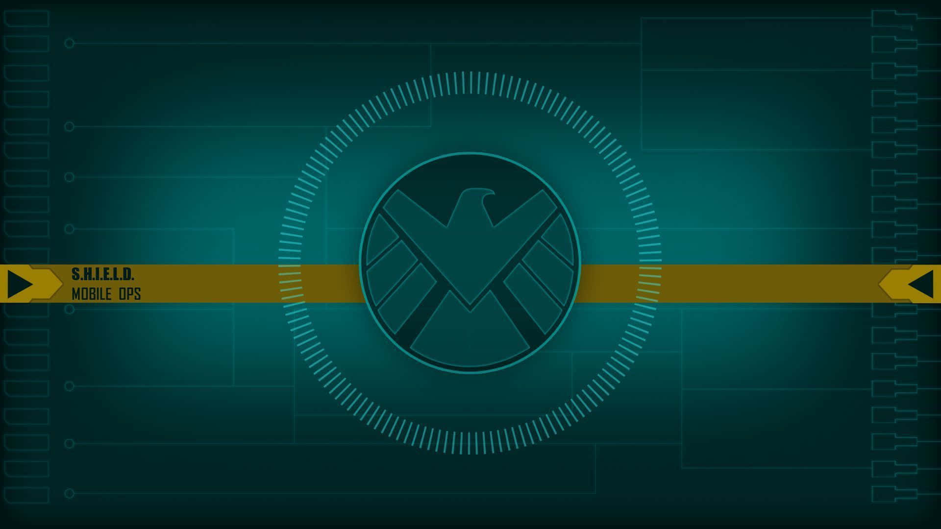 shield 桌布 壁紙 — 一個數位介面顯示S.H.I.E.L.D.標誌，位於發光圓形HUD中央，背景為帶有電路線的青色。