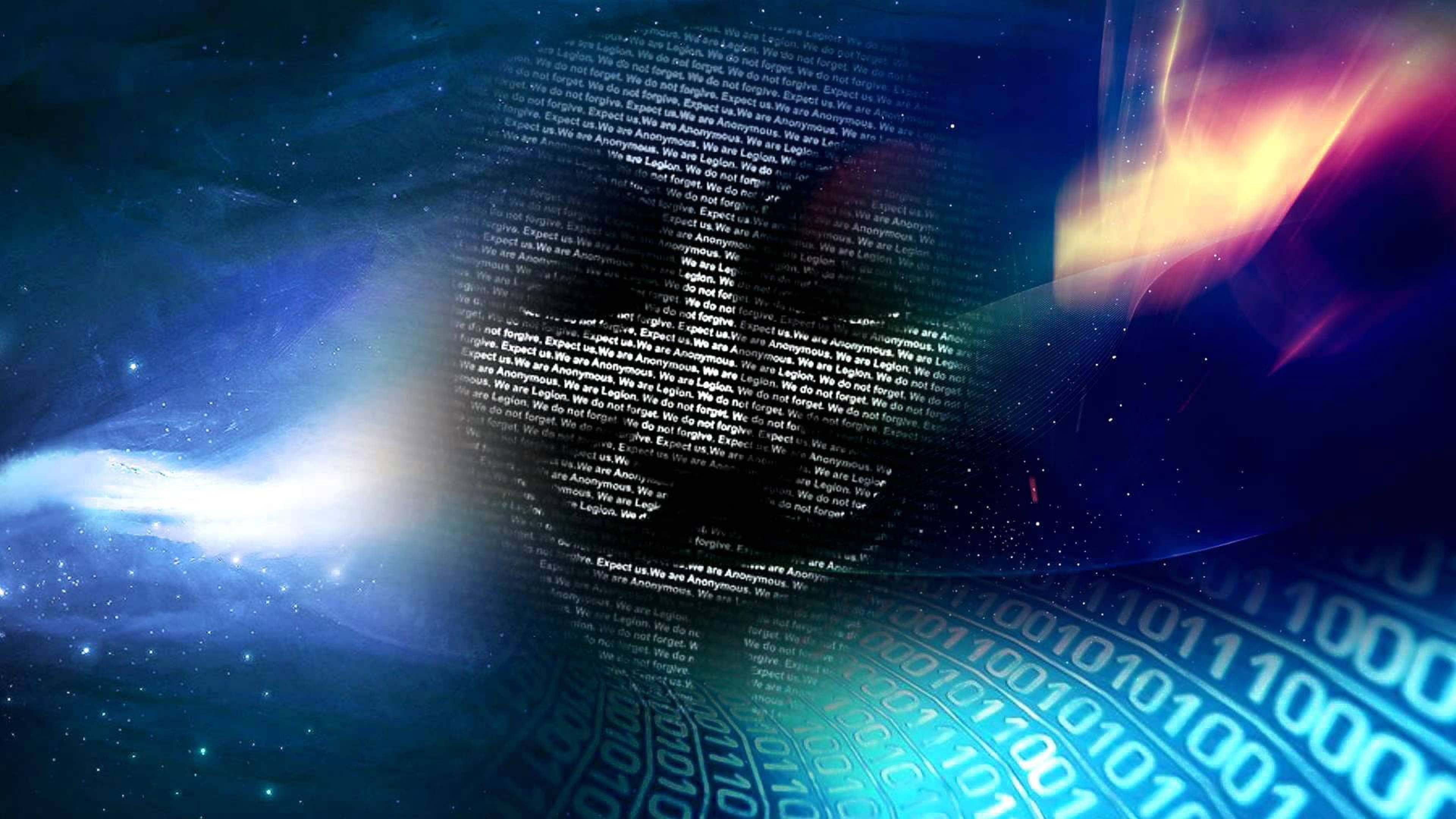 駭客 桌布 壁紙 — 一個數位頭骨從旋轉的二進位代碼和宇宙星雲中浮現，背景是繁星點點的太空。